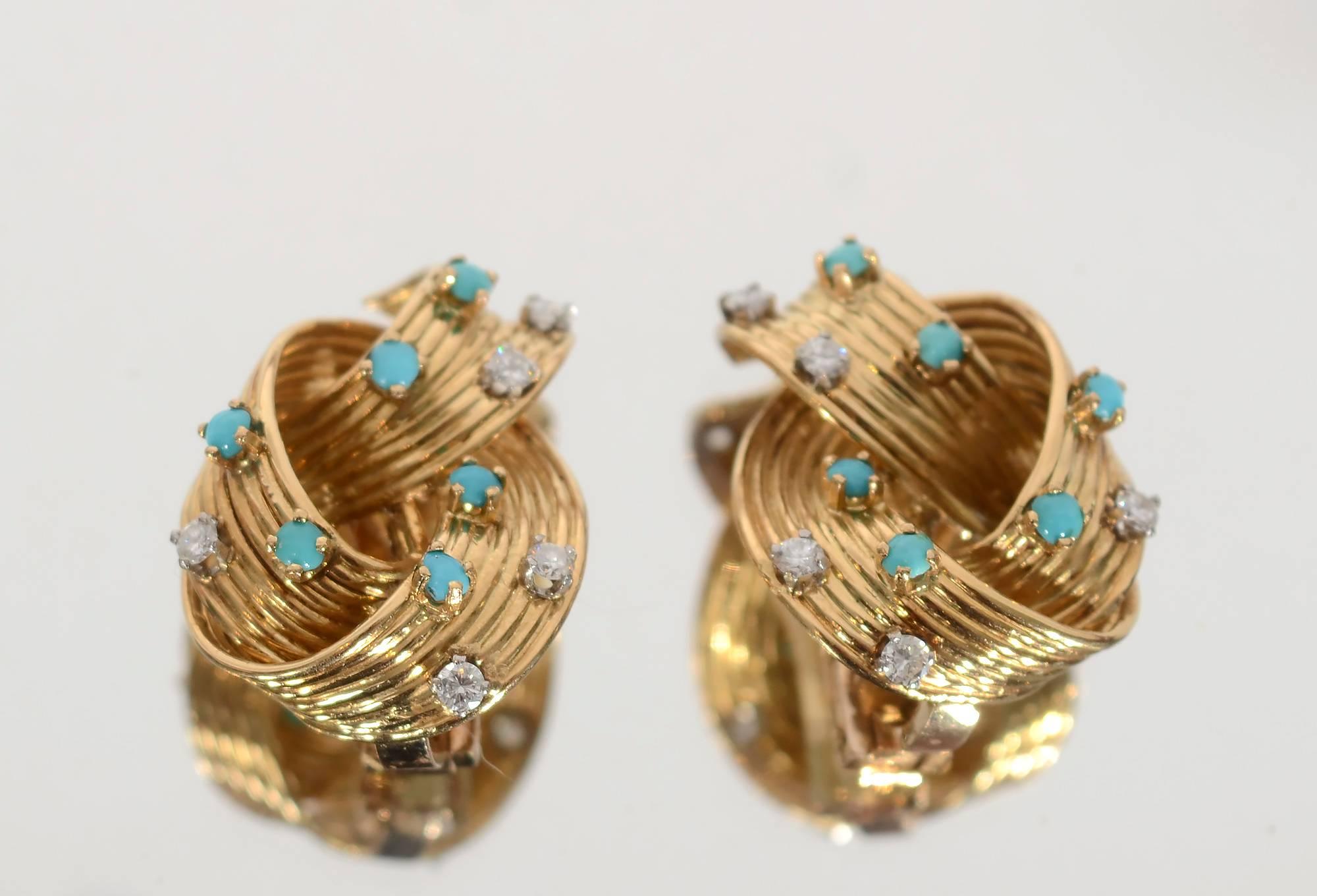 Very 1960's ribbed and looped earrings with diamonds and turquoise. Backs are clips. The earrings measure 1 inch long and 5/8 inch wide.