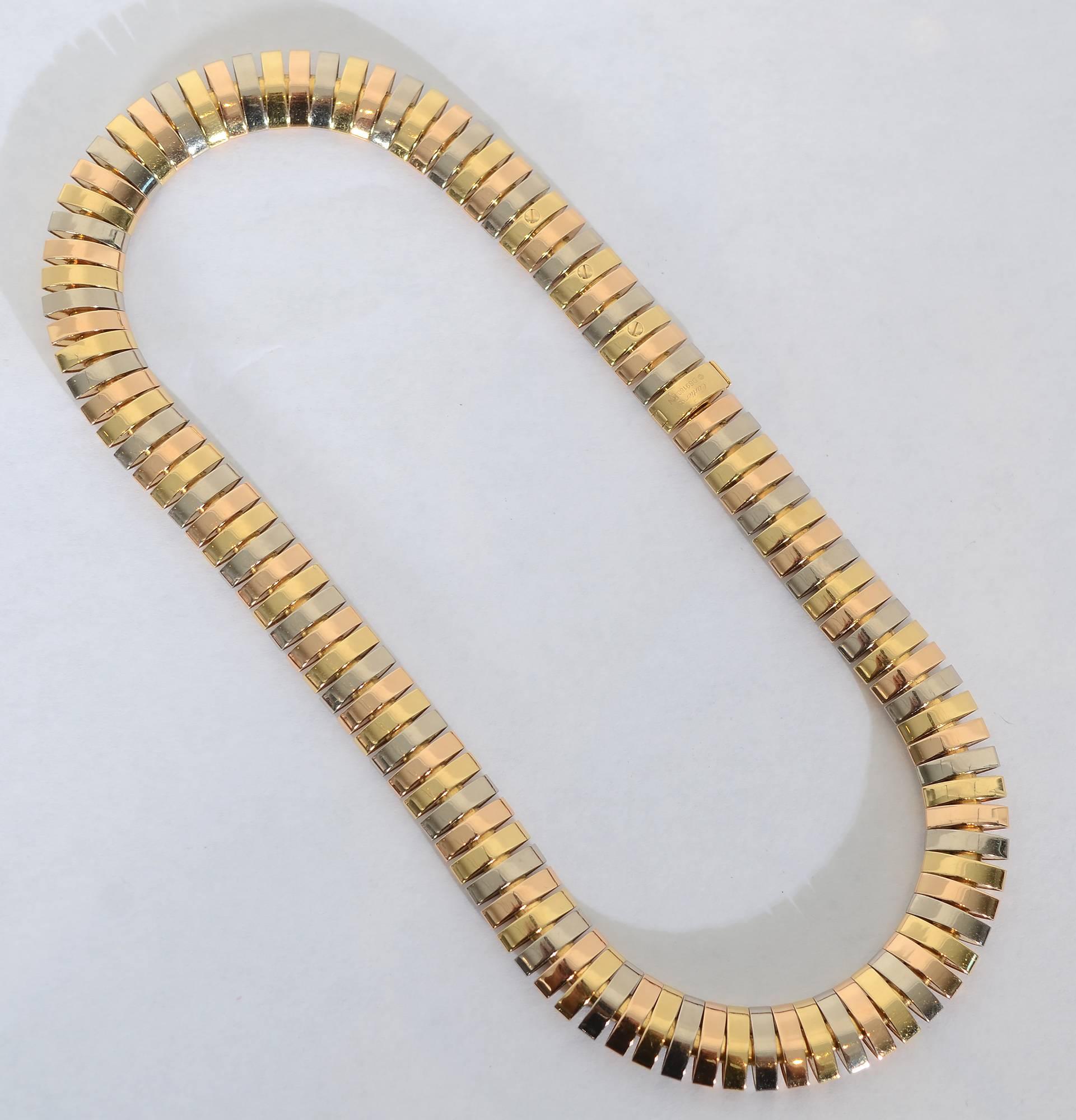 Cartier choker necklace made of the trinity of 18 karat gold colors for which they are so well known. The necklace is wonderfully supple and comfortable to wear. Measurements are 16 inches in length and half an inch in width. 