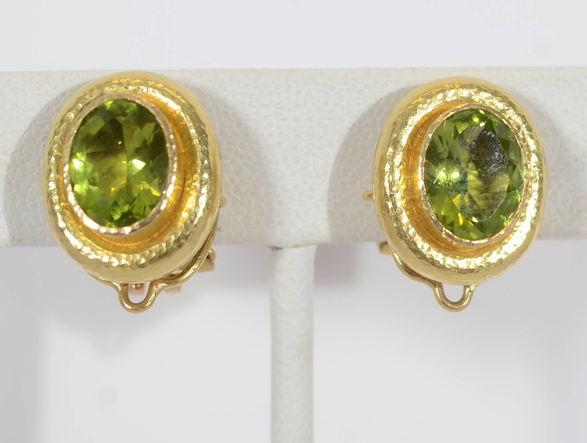 Elizabeth Locke versatile faceted peridot  earrings with a removable drop pendant. The earrings are shown both as oval discs measuring 5/8 " in length and with the pear shaped drop making a total length of 1 5/16".Backs are clips with