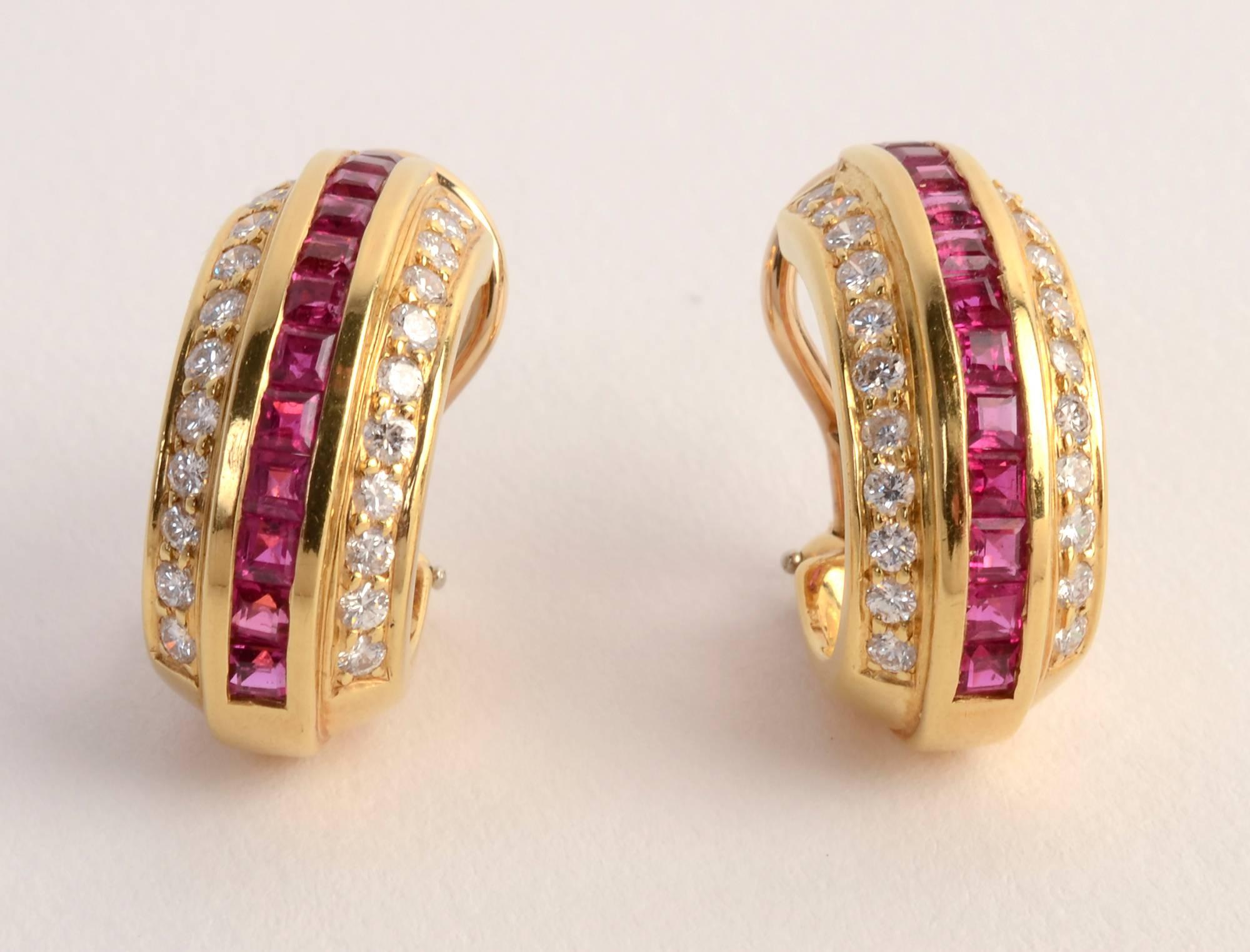Elegant ruby and diamond oval hoop earrings by Cartier. There are 44 round diamonds weighing a total of .88 carats. Backs are posts and clips. Measurements are 3/4 inch in length and 3/8 inch  in width.