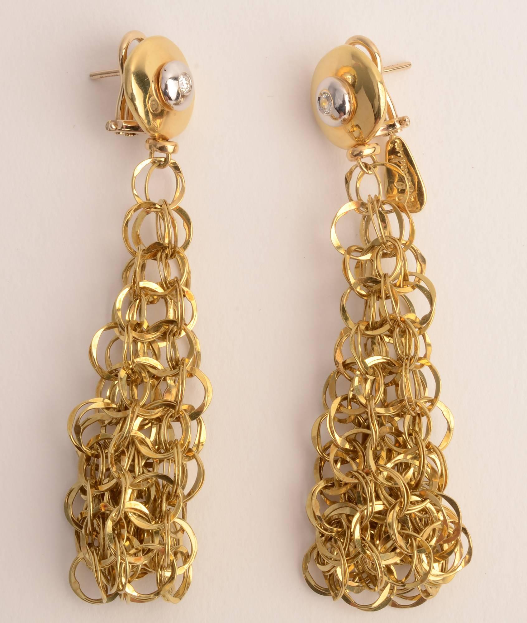 Fresh and airy interlocking circles drop earrings by Orlando Orlandini. Each is topped with a gold circle 5/8