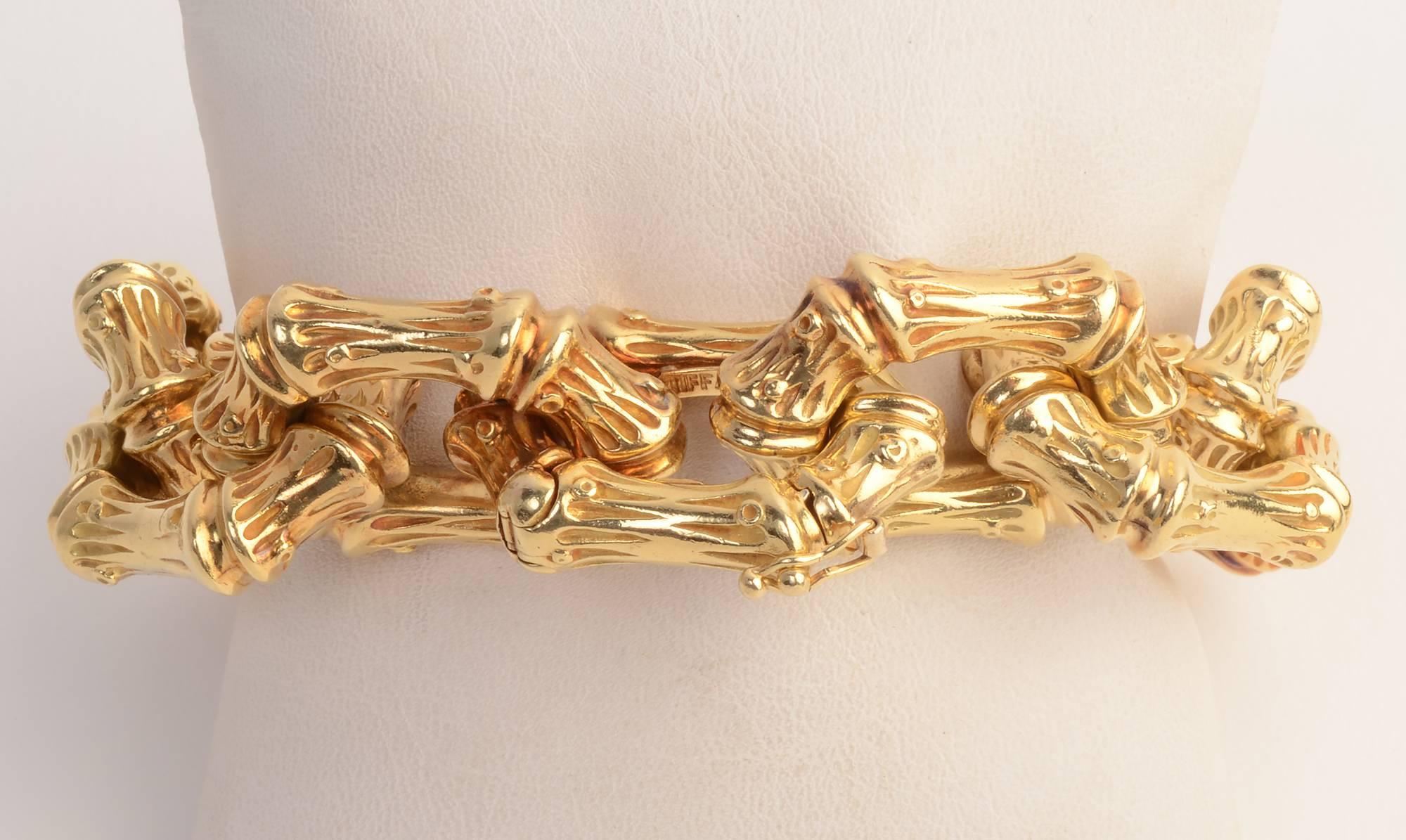 Extremely striking bamboo design bracelet by Tiffany in 18 karat gold. The bracelet weighs a stunning 183 grams. The links are 1 inch in diameter and 1 1/4 inches in length.The 8 1/2 inch length is deceiving. Because the links are so large, they