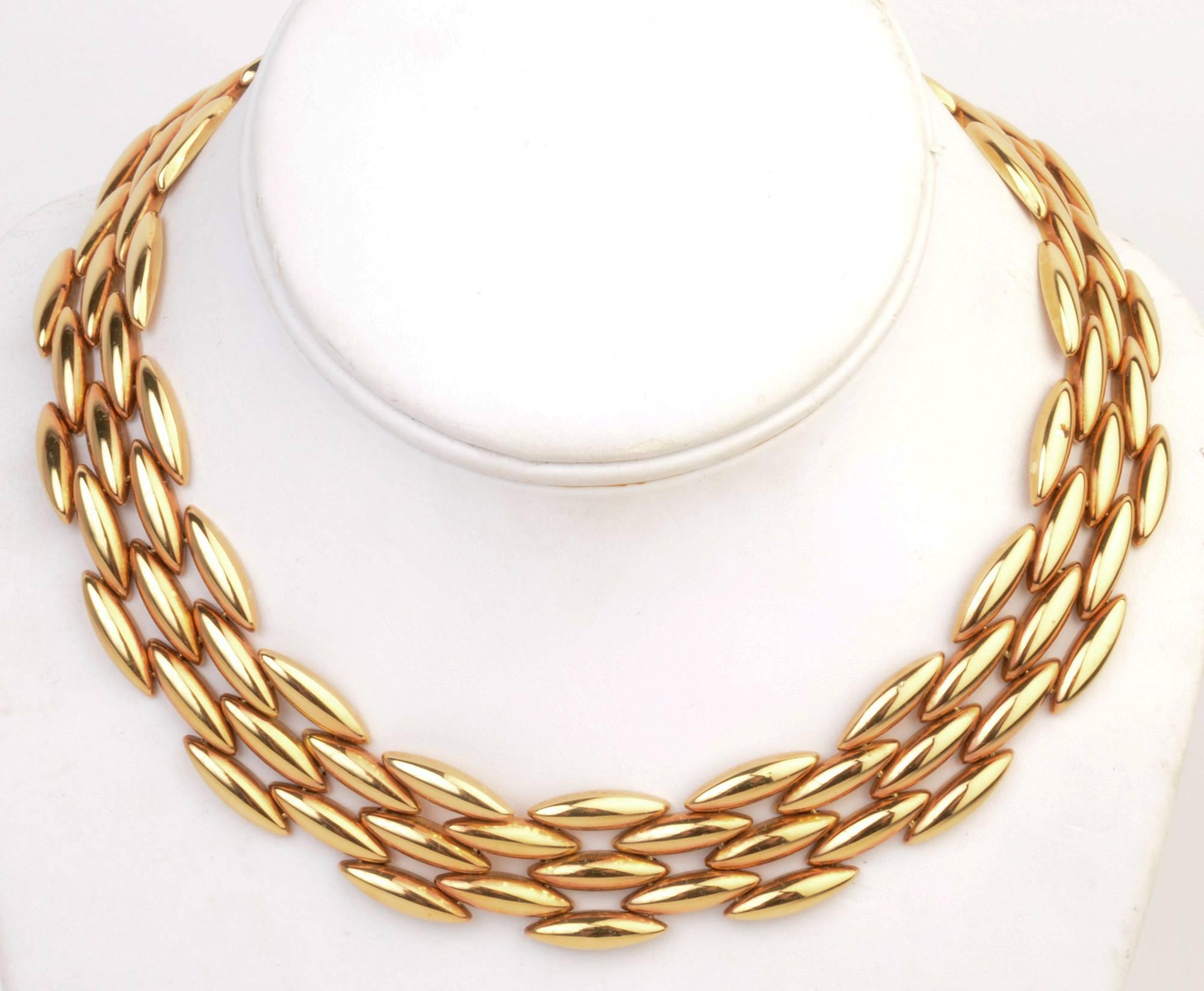 Classic Cartier navette shaped link necklace in eighteen karat gold. The necklace is 16 inches long and 3/4 " wide. A matching bracelet is available as item  LU1333250493.