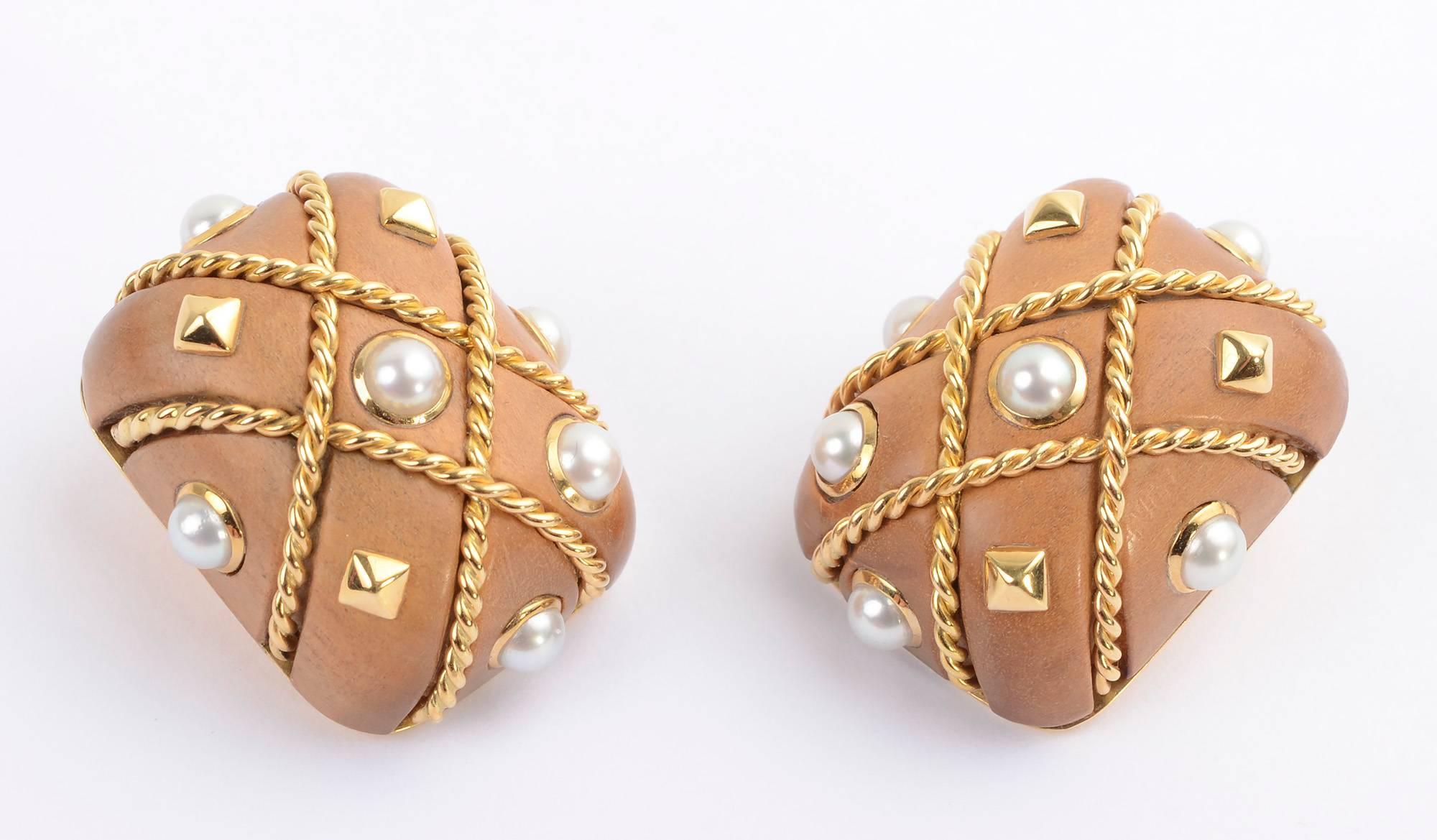 Classic Seaman Schepps 18 karat gold Cage earrings . Crisscross bands of twisted gold are interspersed with pearls and gold diamonds. The body of the earrings is made of walnut. They measure 13/16