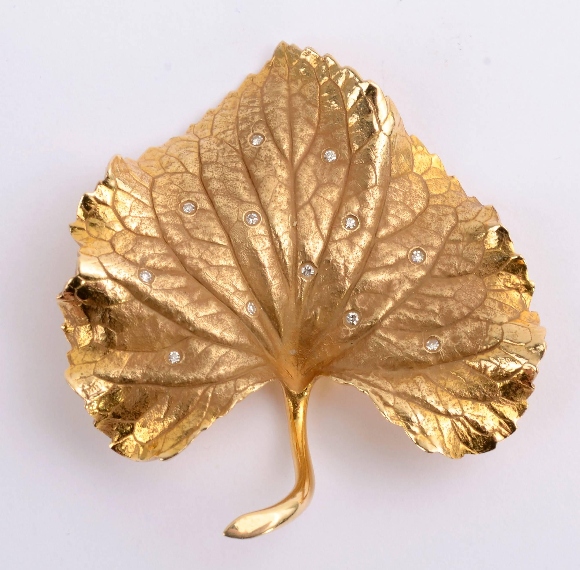 Finely made brooch depicting a Violet leaf. It is quite realistic in texture and undulation. It is highlighted with 12 small diamonds for a hint of sparkle. Measurements are 1 9/16
