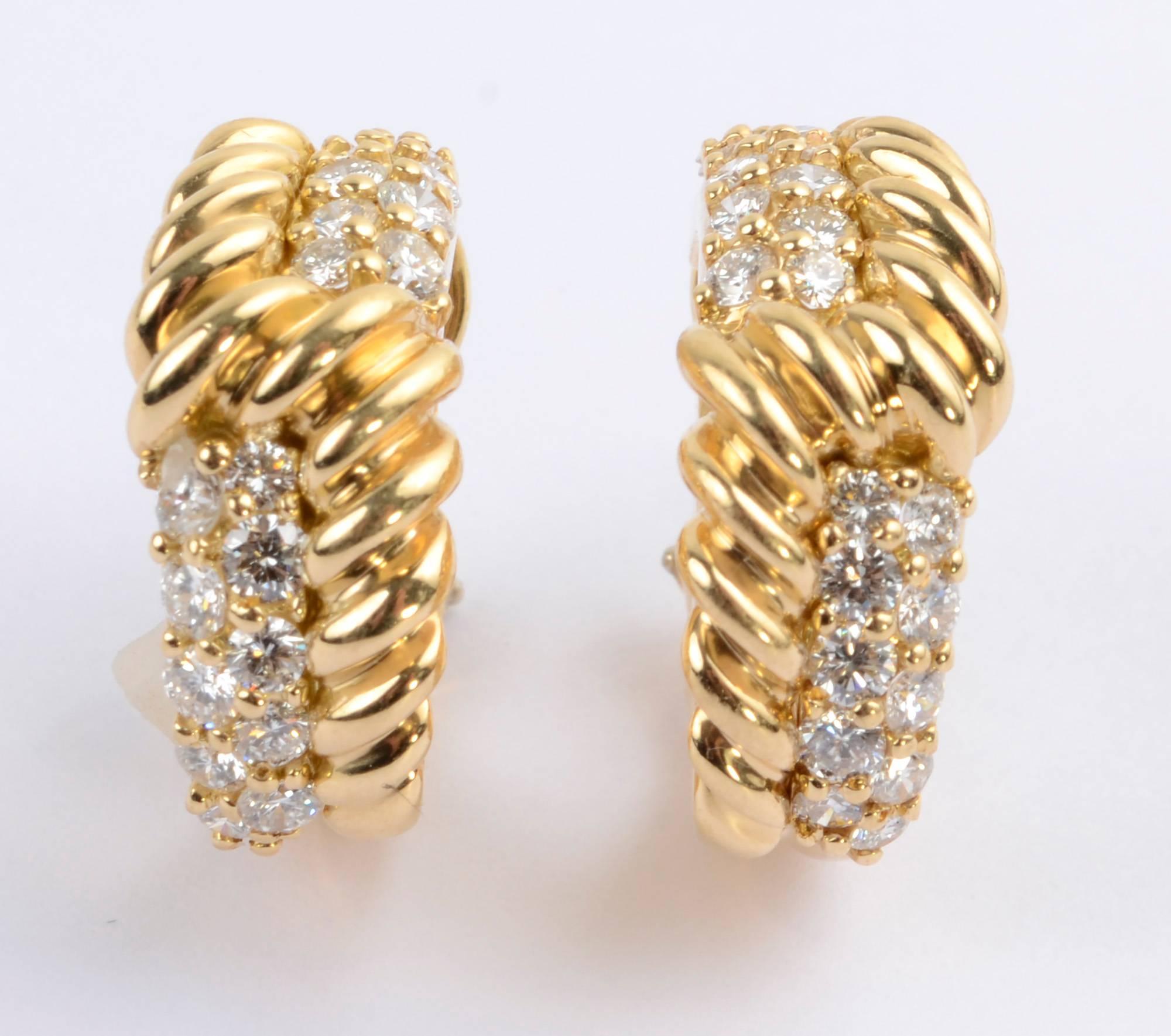 Hammerman Brothers hoop earrings with twisted gold and approximately 1.6 carats of round brilliant cut diamonds. An interesting design alternates the placement of the gold with diamonds between. Clip backs can be converted to posts.