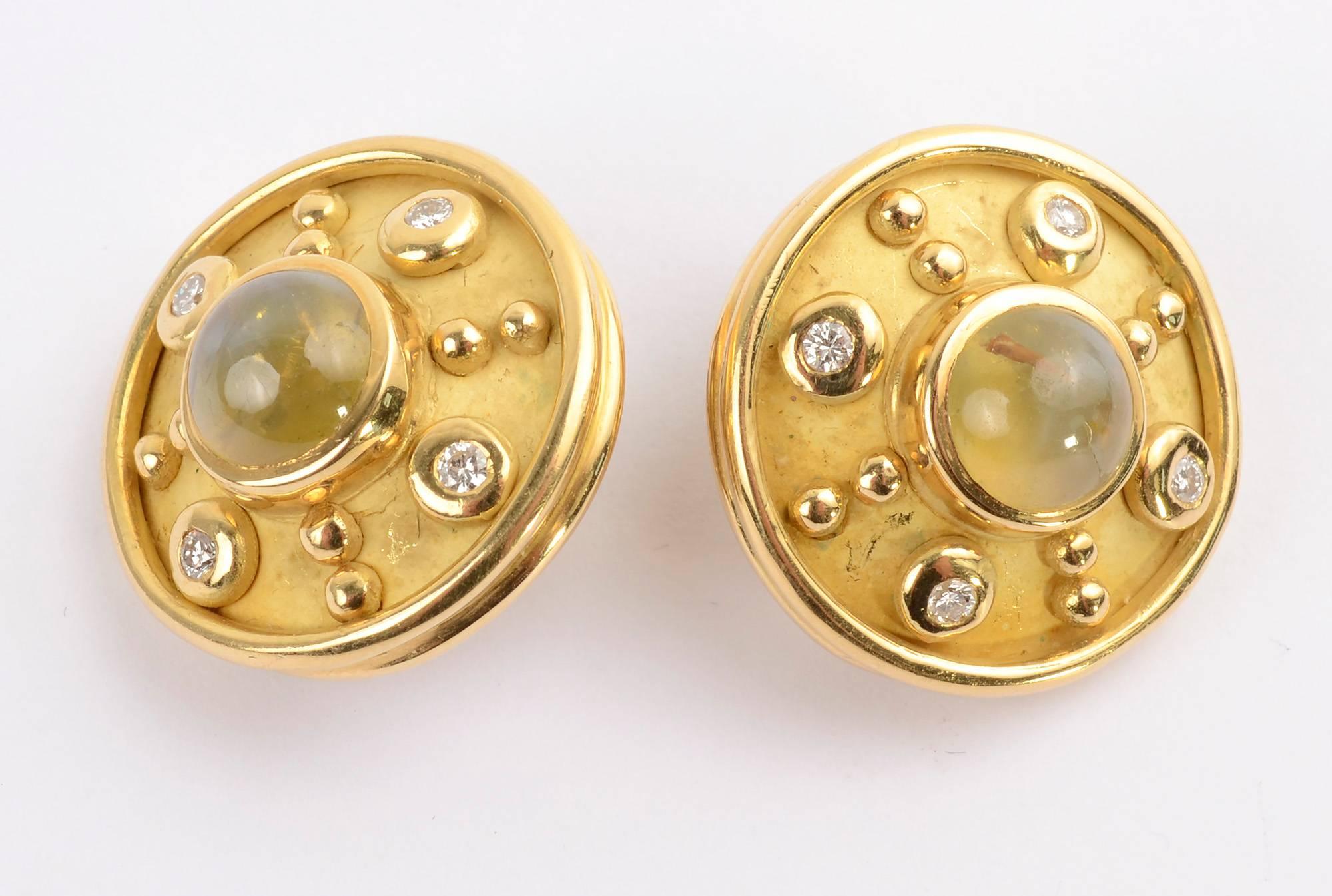 Sporty and stylish earrings by Denise Roberge. Each is centered with a cat's eye chrysoberyl measuring 5/16
