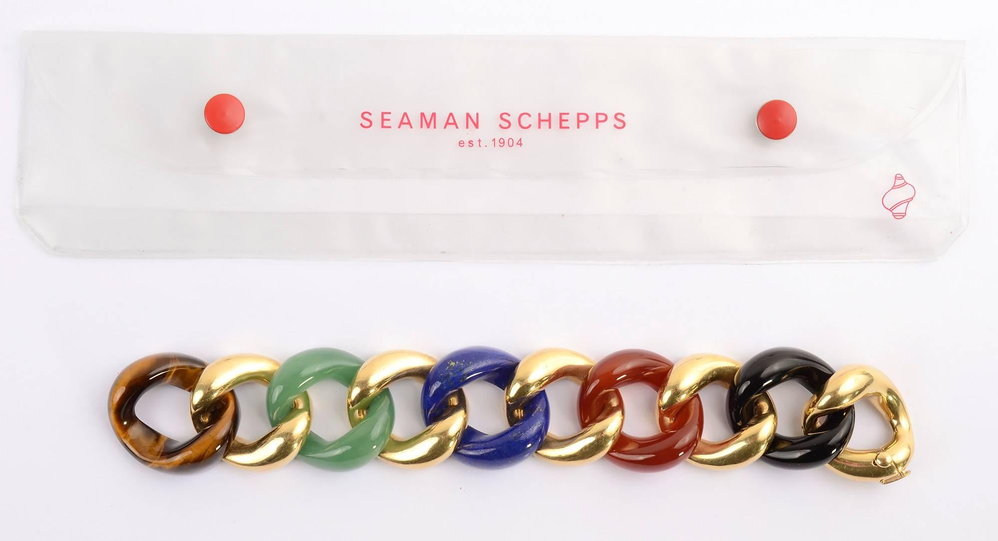 Seaman Schepps Classic Curbchain Link bracelet in which links of 18 karat gold alternate with black onyx; carnelian; lapis lazuli; jade and tiger's eye. The bracelet comes in two sizes - this is the larger one. It measures 7 3/4 inches long and 1