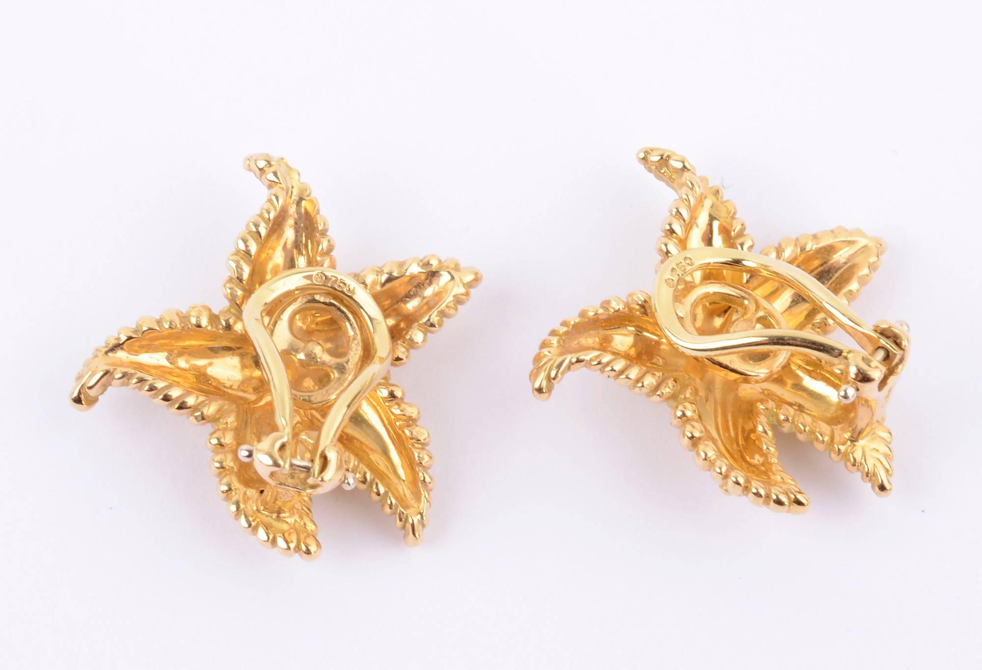 Tiffany eighteen karat gold Starfish earrings that are wonderfully sculptural. In addition, they have finely detailed texture. The earrings measure 1 1/16 inches wide and  tall. Clip backs can easily be converted to posts.