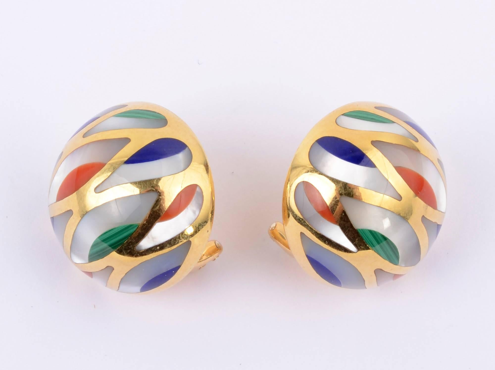 Colorful dome shaped earrings by Asch Grossbardt. They are set with mother of pearl; lapis lazuli; malachite and coral. Backs are clips and posts. They measure one inch in diameter.