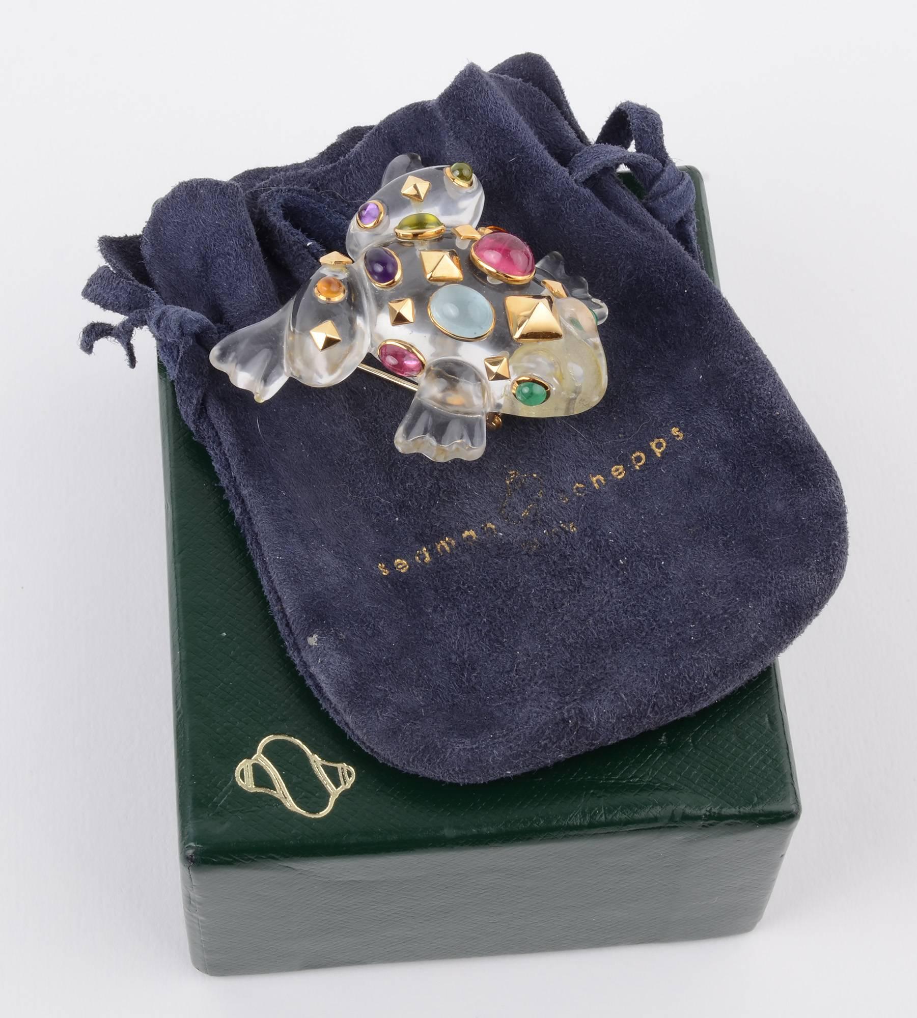 Fabulous Seaman Schepps Frog Brooch, one of their iconic pieces. This fine example has a crystal body  with emerald eyes and encrusted with amethyst; citrine; tourmaline; chalcedony and nine diamond shaped medallions of gold. It has a double pin