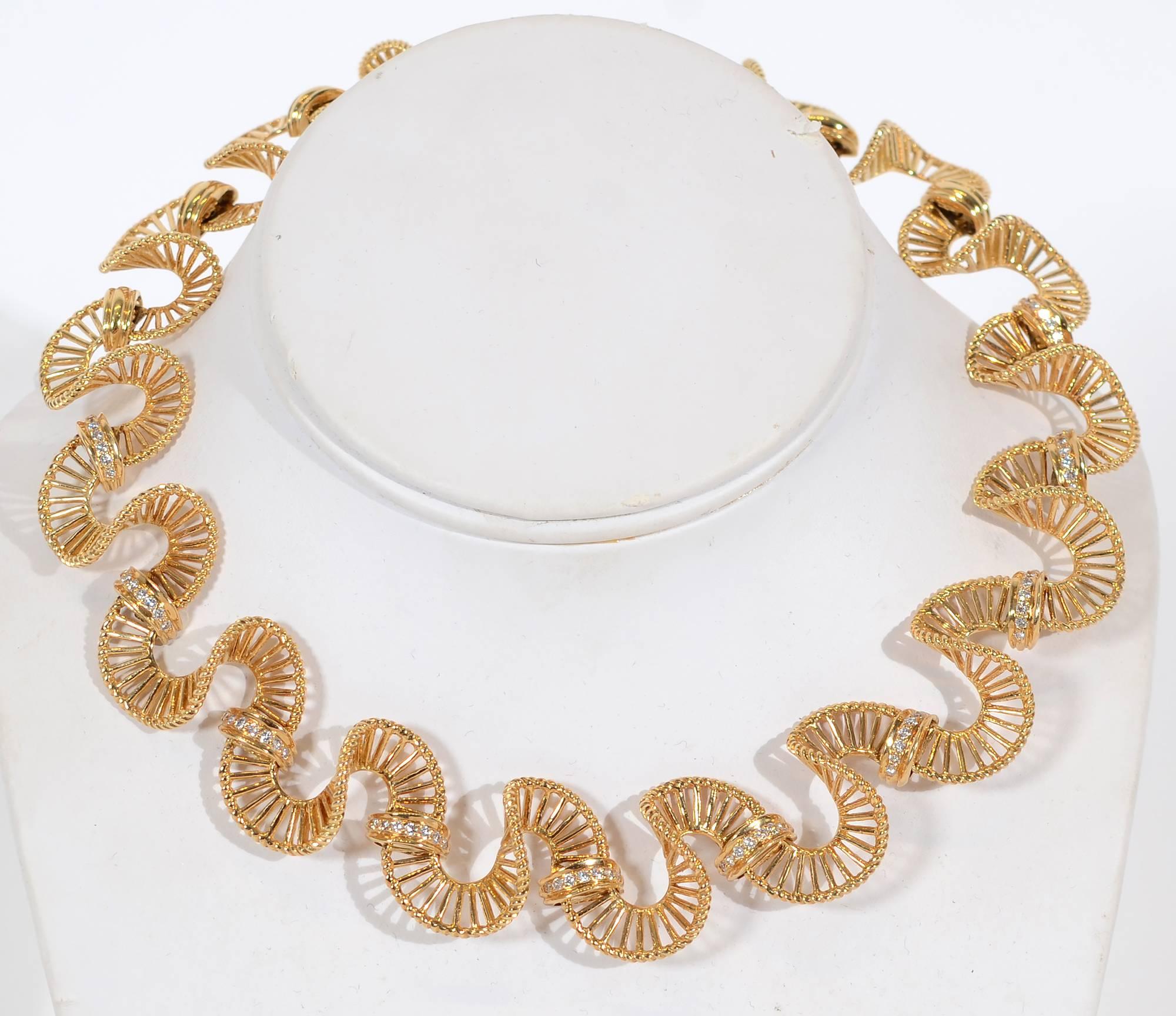 This graceful ribbon-like gold necklace with diamonds was made by Irving Gold, designer of jewelry for Van Cleef and Arpels. This piece was from his personal collection made for his wife. 
Seventy diamonds have an approximate weight of 1.75 carats.