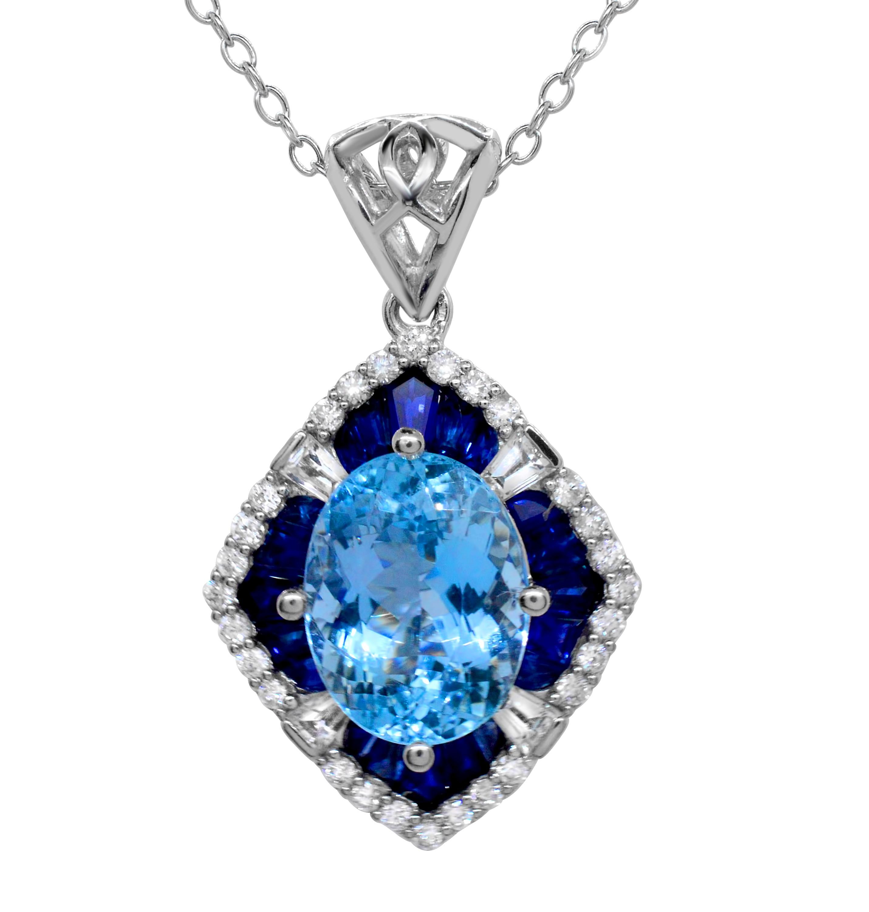 A stunning 10 x 8 mm Oval Aquamarine Scalloped White Gold Pendant.  The center aqua weighs 2.49 carats.  The hand-set blue and white sapphires that frame the center, are of varying sizes and weigh a total of 2.29 carats.  This piece has a total
