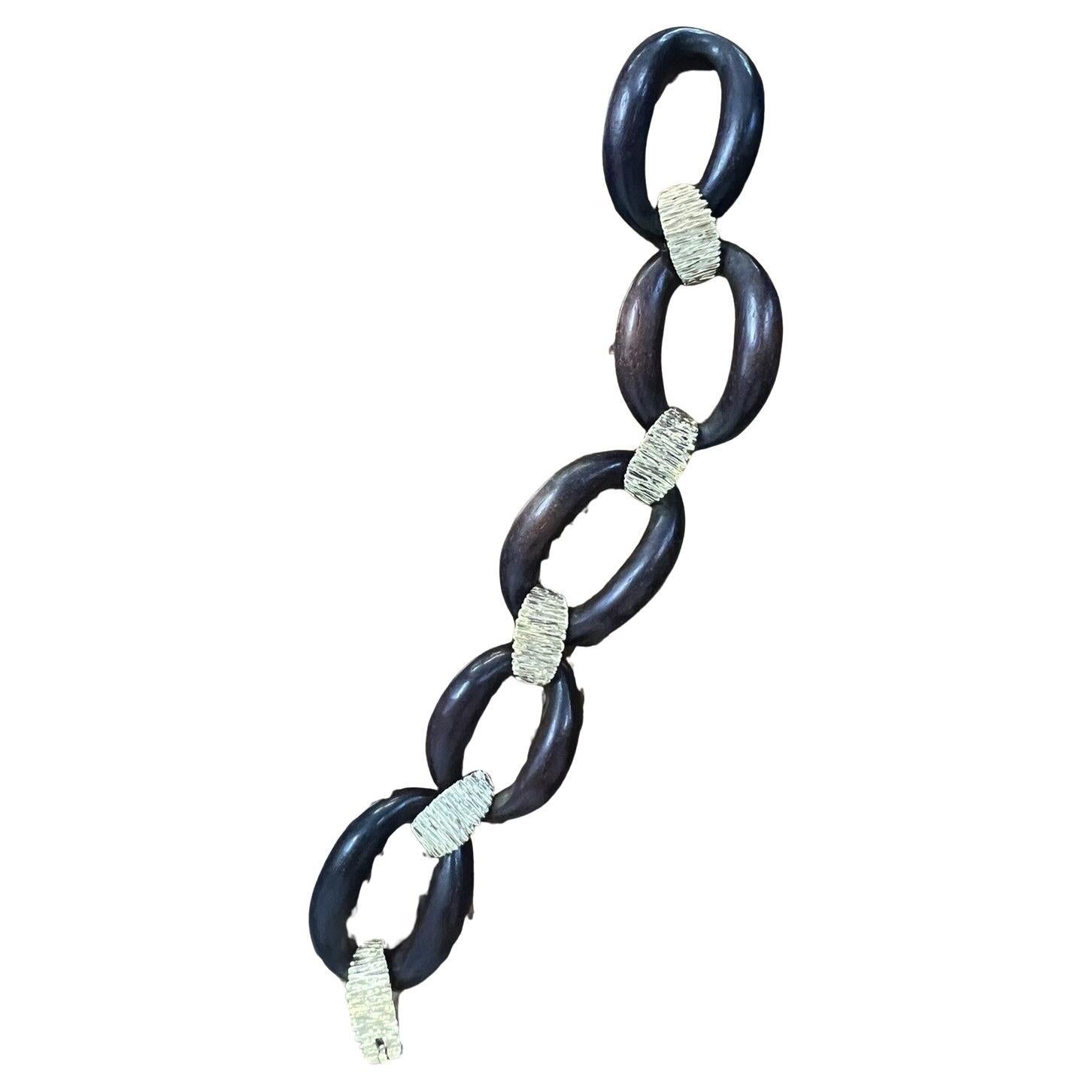 Cartier Paris by Pery Et Fils 18k Yellow Gold & Wood Bracelet Vintage Circa 1970s

Here is your chance to purchase a beautiful and highly collectible designer bracelet.  

The bracelet is made by Cartier Paris in the 1970s by maker Pery Et Fils. 