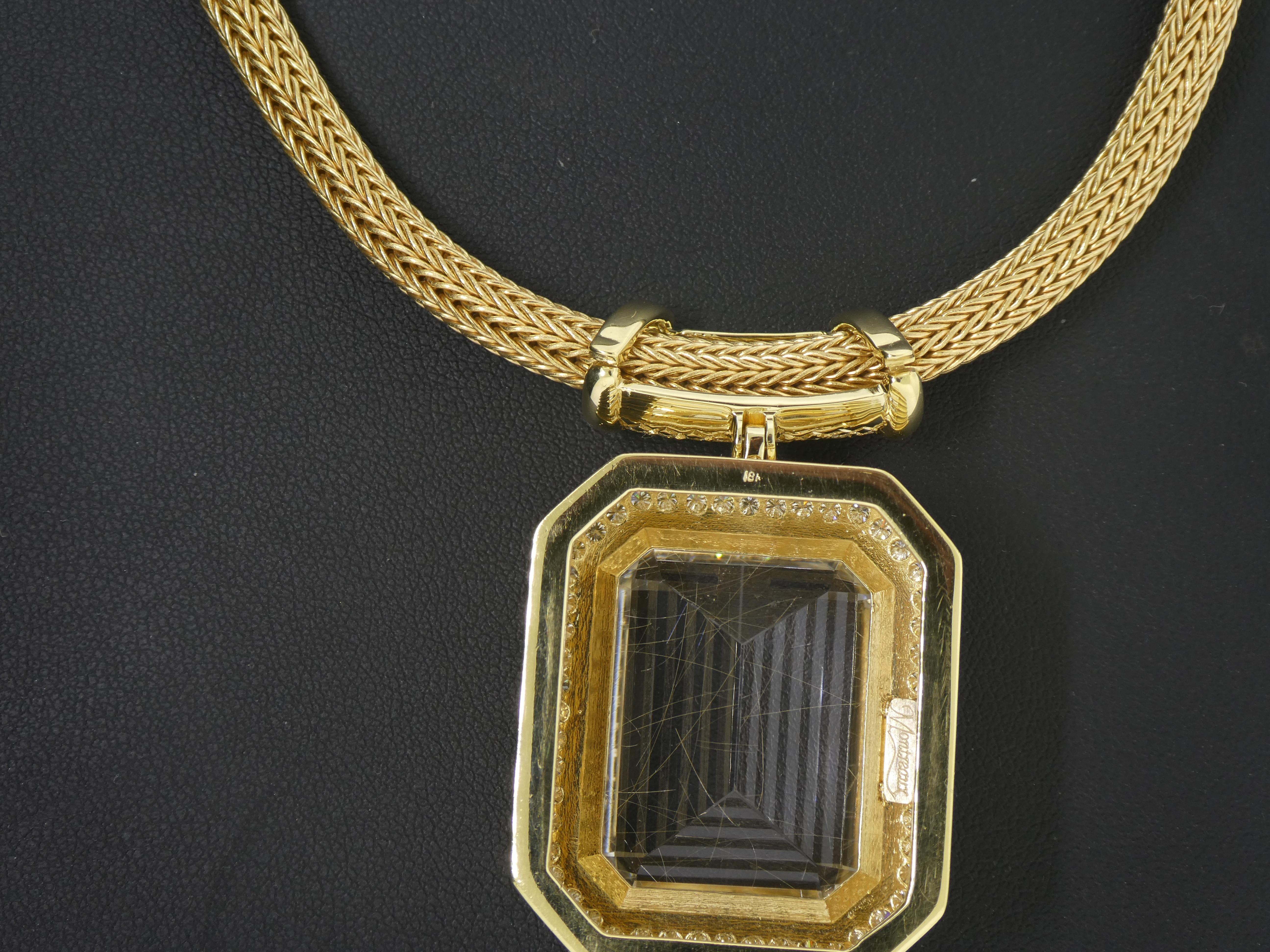 Set in 18 Karat Yellow Gold, designer Michael Engelhardt brings you a World Class piece of Rutile Quartz, hanging from a diamond bar and surrounded by a row of diamonds (91=4.18 carats).  What is so special about this piece of Rutile Quartz, are the