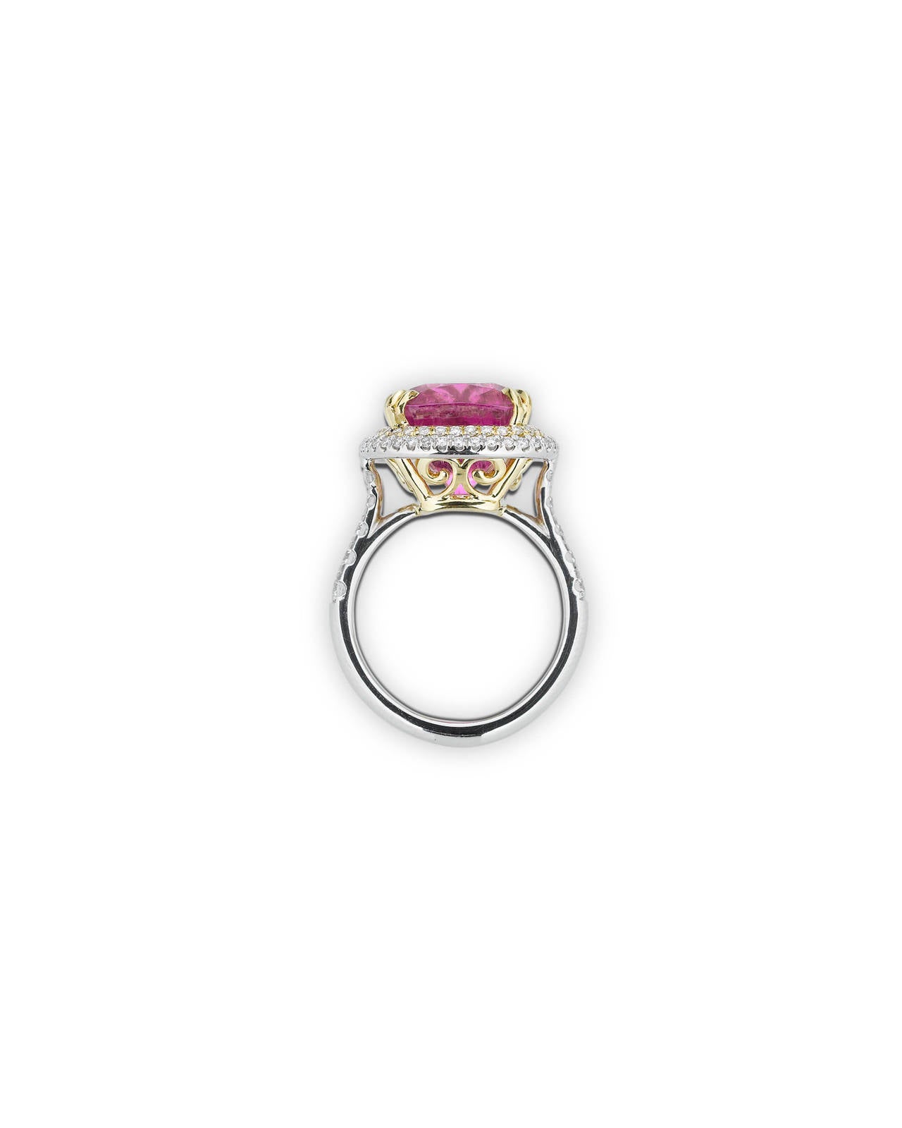 An enchanting Cuprian tourmaline is the star of this exquisite ring. Pink is among the most sought-after hues in which to find this colorful gem, and the distinctive, rosy-pink of this 9.99-carat stone is truly remarkable. Encircled by 0.89 carats