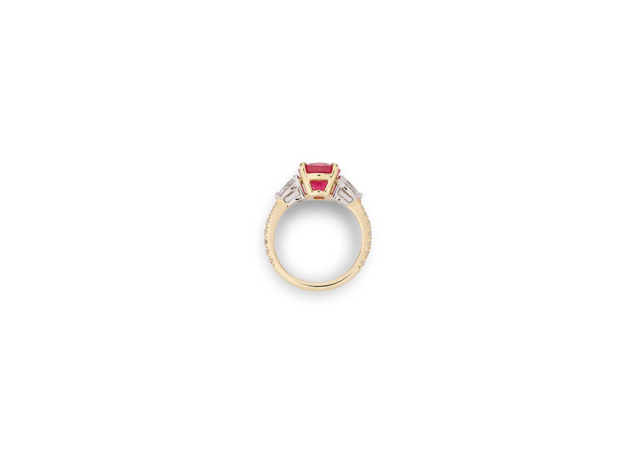 A sparkling pink spinel captivates the eye in this enchanting ring. Exhibiting a stunning and rare pink hue, this 3.39-carat jewel is flawlessly set in platinum and 18K yellow gold. The dazzling gemstone is perfectly complemented by .80 carats of