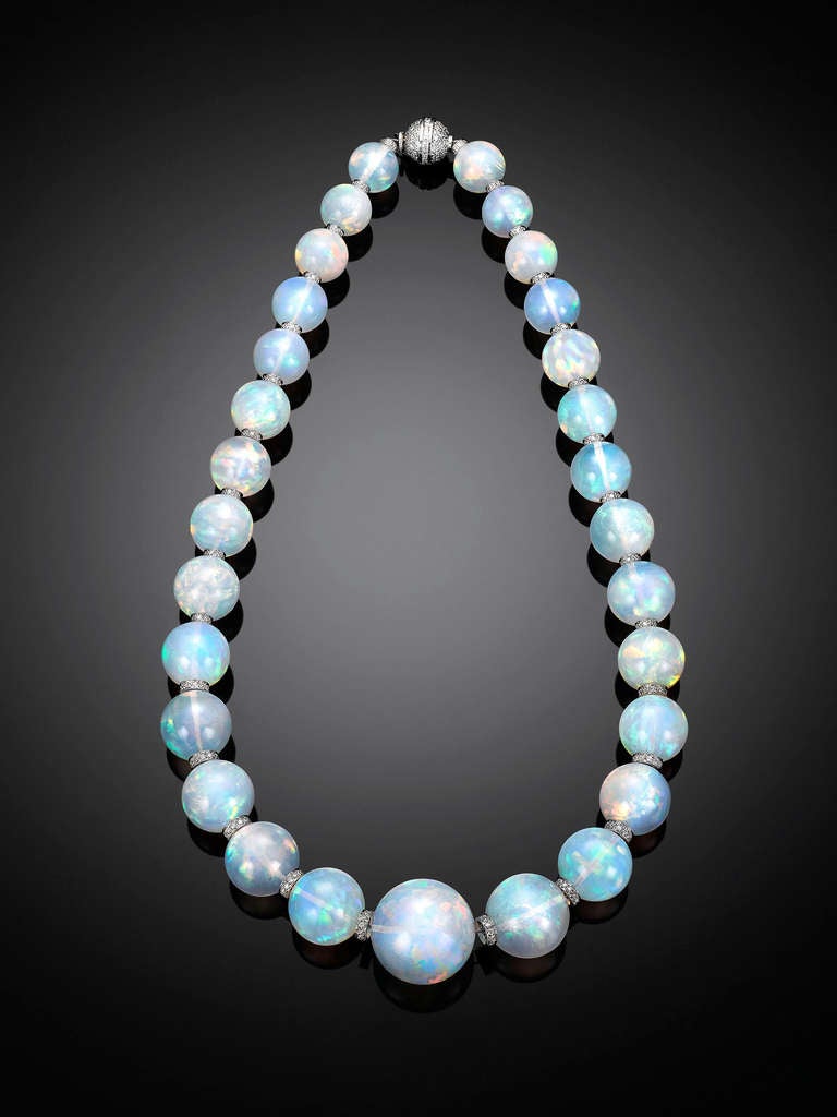Twenty-nine rare and large opal beads totaling an extraordinary 554 carats comprise this mesmerizing necklace. The graduated gems are an impressive size, measuring from 13mm to 23.8mm, with each exhibiting a high level of translucence and a rainbow