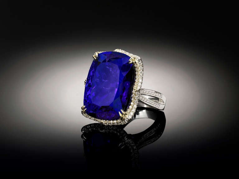 Weighing an astonishing 78.78 carats, this awe-inspiring natural Tanzanite dazzles with its incomparable and prized violet blue color. The jewel is formed in a cushion-shape with a modified brilliant cut, and has been certified by the American