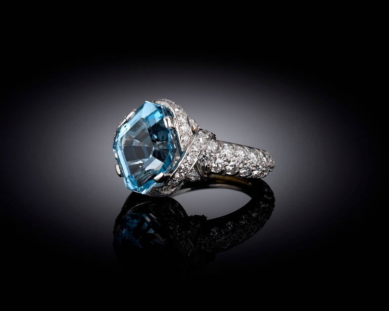 This extraordinary Tiffany & Co. aquamarine ring is the epitome of glamour. Designed by the legendary Jean Schlumberger, this striking design centers around a beautiful 4.97-carat, lozenge-cut aquamarine which displays an exquisite, ocean-blue hue.