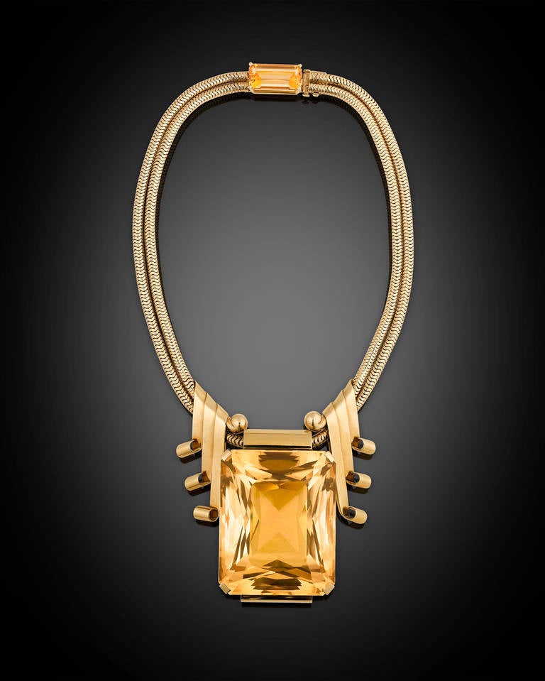 From the personal collection of style icon Joan Crawford, this amazing citrine necklace and bracelet suite was crafted by Raymond Yard, jeweler to the stars. A giant dazzling brilliant-cut citrine weighing approximately 350.00 carats takes center
