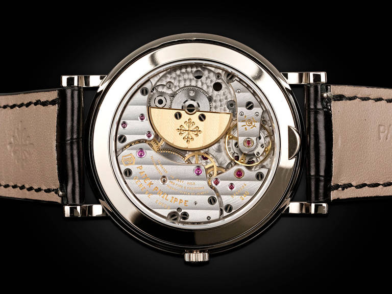 An extraordinary marvel of modern horological design, Patek Philippe's 18k white gold perpetual calendar wristwatch, Ref. 5139G, is crafted with an automatic caliber 240 Q movement with micro-rotor. The slender 18K white gold case and its sleek and