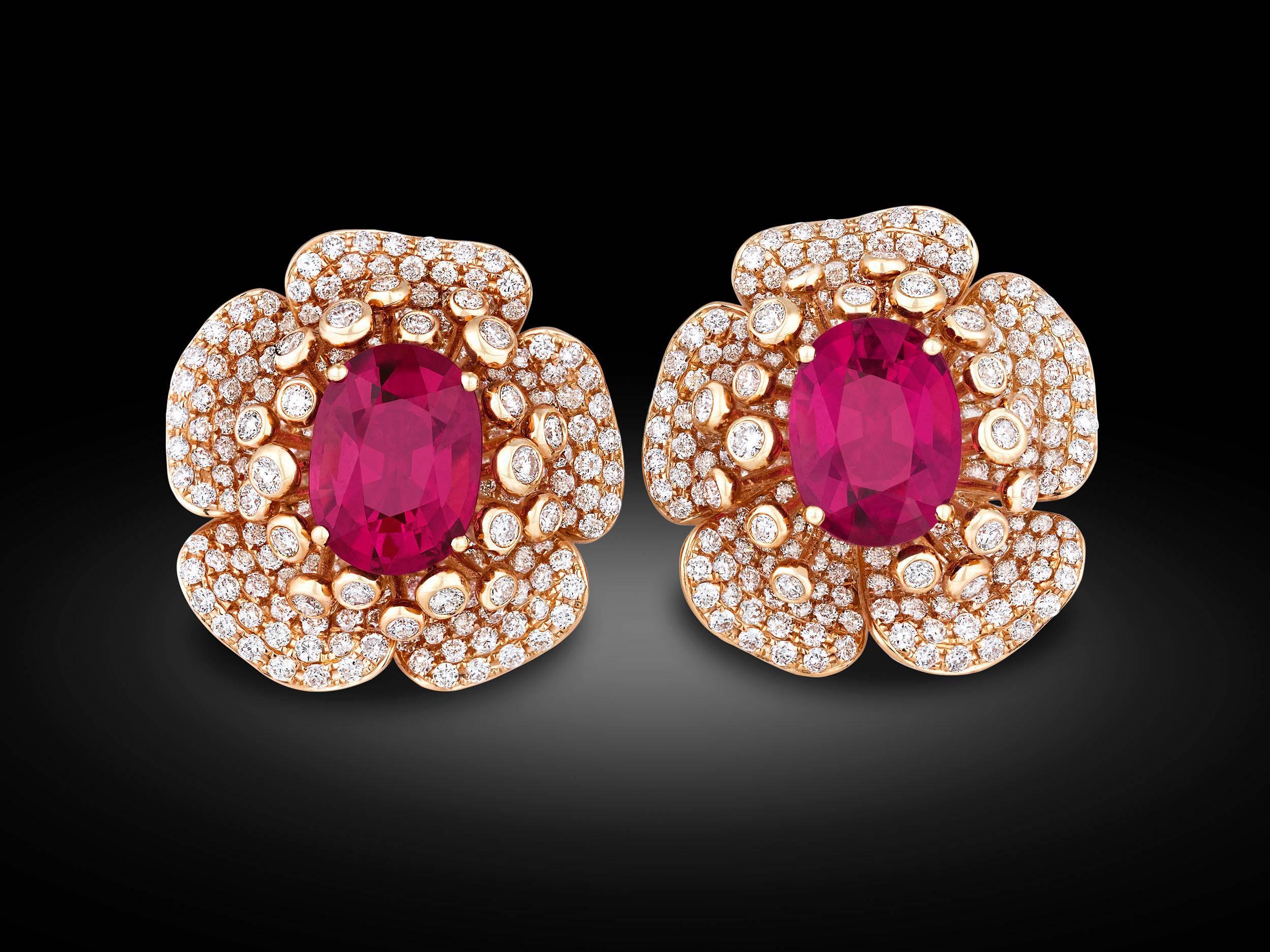 Shimmering gemstones are in full bloom in this sensational pair of rubellite and diamond earrings. Two rubellite tourmalines totaling 9.87 carats rest at the center of the blooms, exhibiting the rich crimson hue that makes these gemstones so