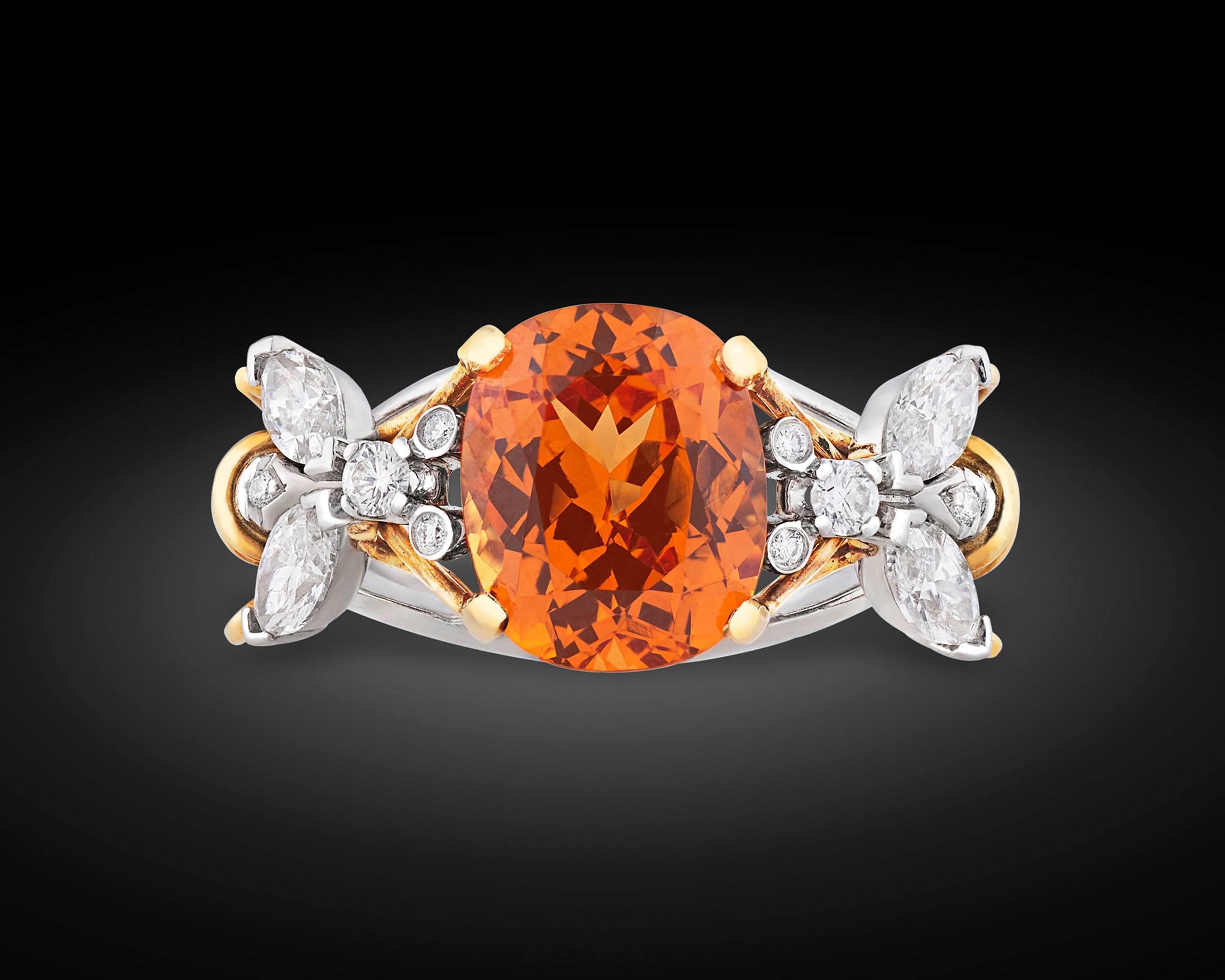 Radiating a beautiful orange hue, a rare spessartite garnet creates quite a buzz in this enchanting ring by Tiffany & Co. Designed by the legendary Jean Schlumberger, this striking design centers around the dazzling 5.49-carat spessartite, which is