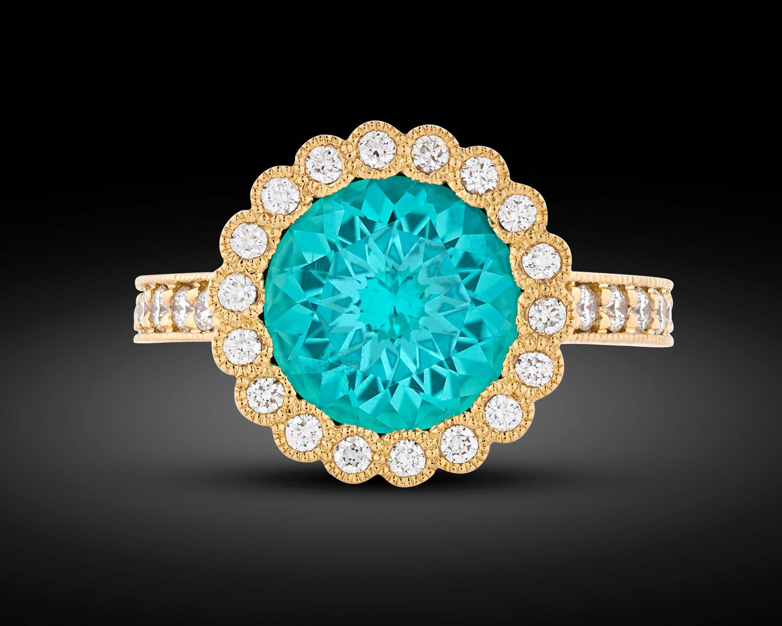 A dazzling 2.86-carat tourmaline is featured in this exquisite ring. Exhibiting a deep turquoise blue hue, the stunning gem is joined by approximately 0.51 carat of shimmering diamonds in its delicate 18k yellow gold setting.

Among the most