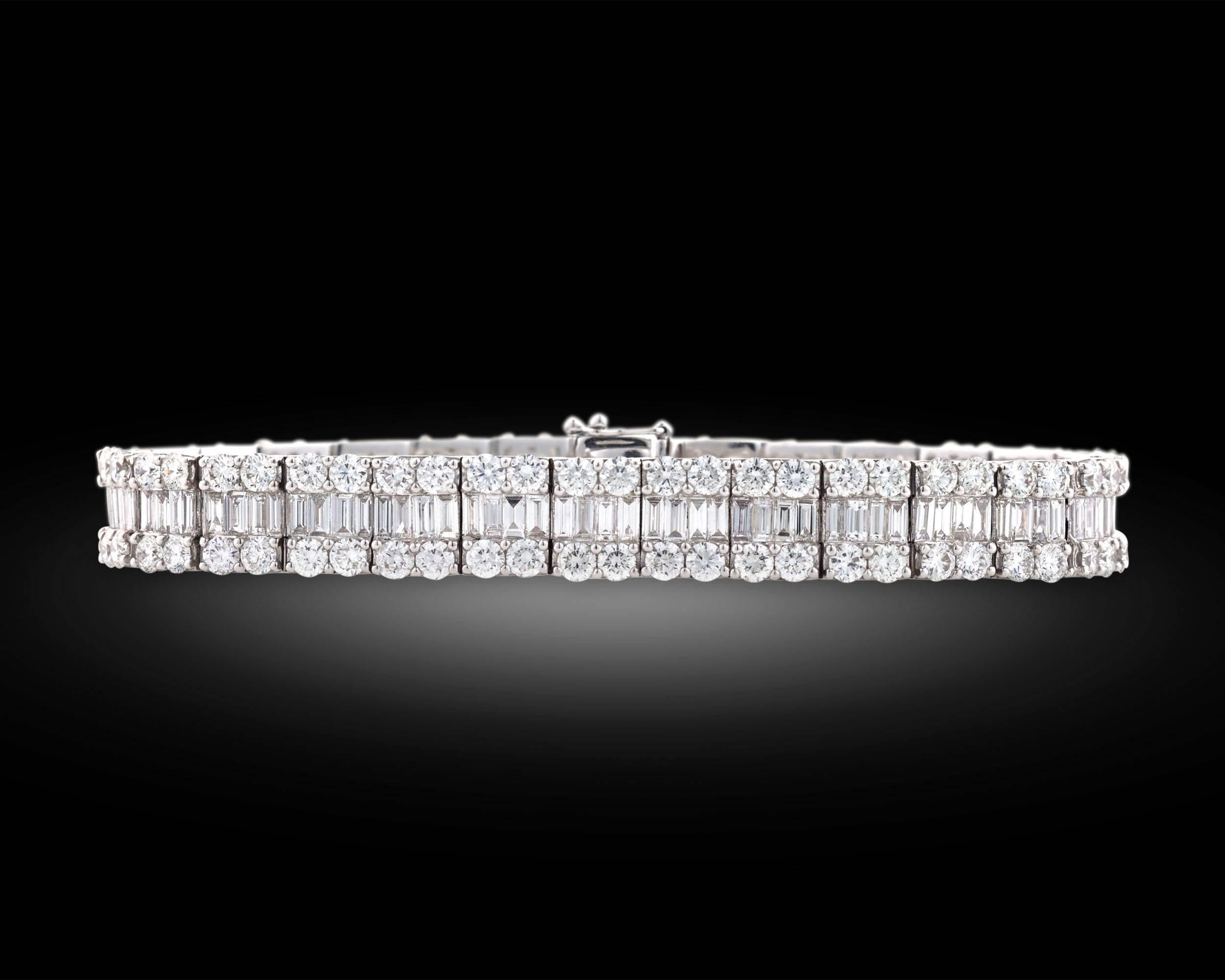 This impeccable bracelet showcases a stunning collection of pure white diamonds. 112 dazzling round-cut diamonds totaling 9.84 carats encase 4.27 total carats of baguette-cut diamonds in the luxurious design. Boasting over 14.00 carats of diamonds