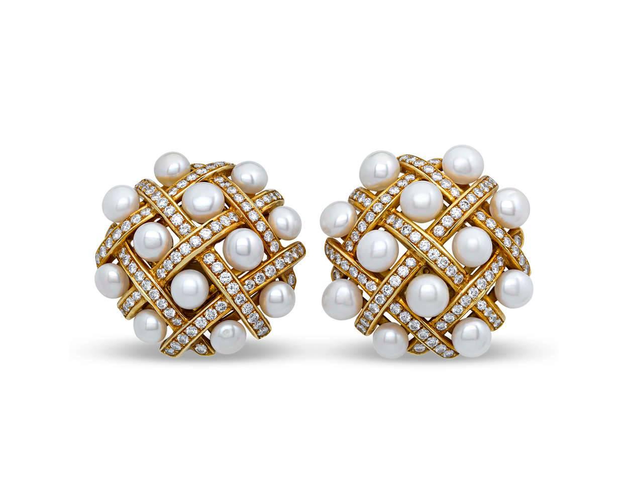 The epitome of haute couture elegance, these striking earrings are a symphony of diamonds and pearls. Crafted in a stunning latticework motif after a design by the legendary Chanel, the 18K gold interwoven strips sparkle with approximately 4.00