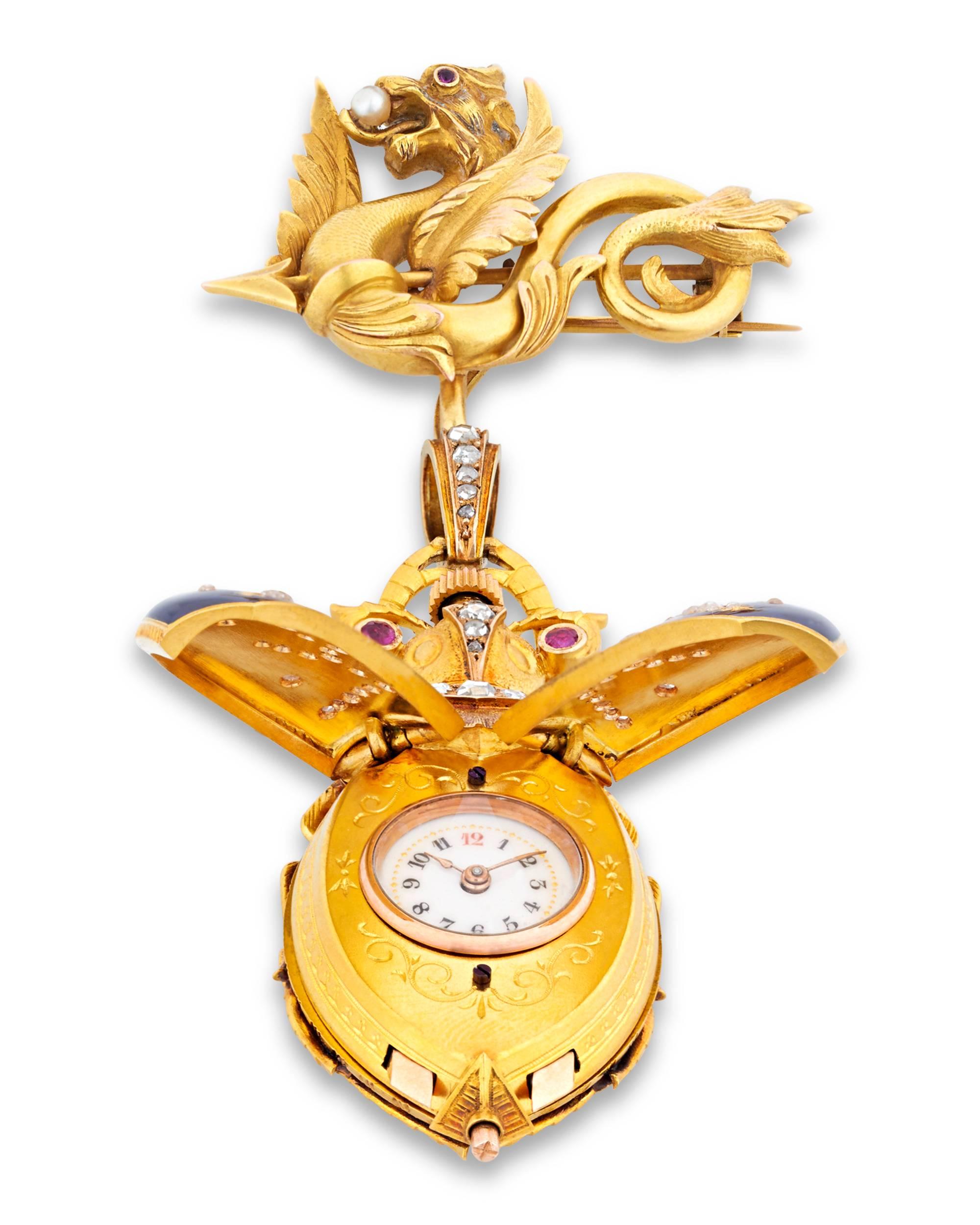 This masterfully crafted Swiss gold lapel watch is an exemplary specimen of Swiss workmanship. Taking the form of an exotic scarab, the enchanting timepiece is formed of meticulously worked 18K gold with exquisite guilloché enameling. A simple press