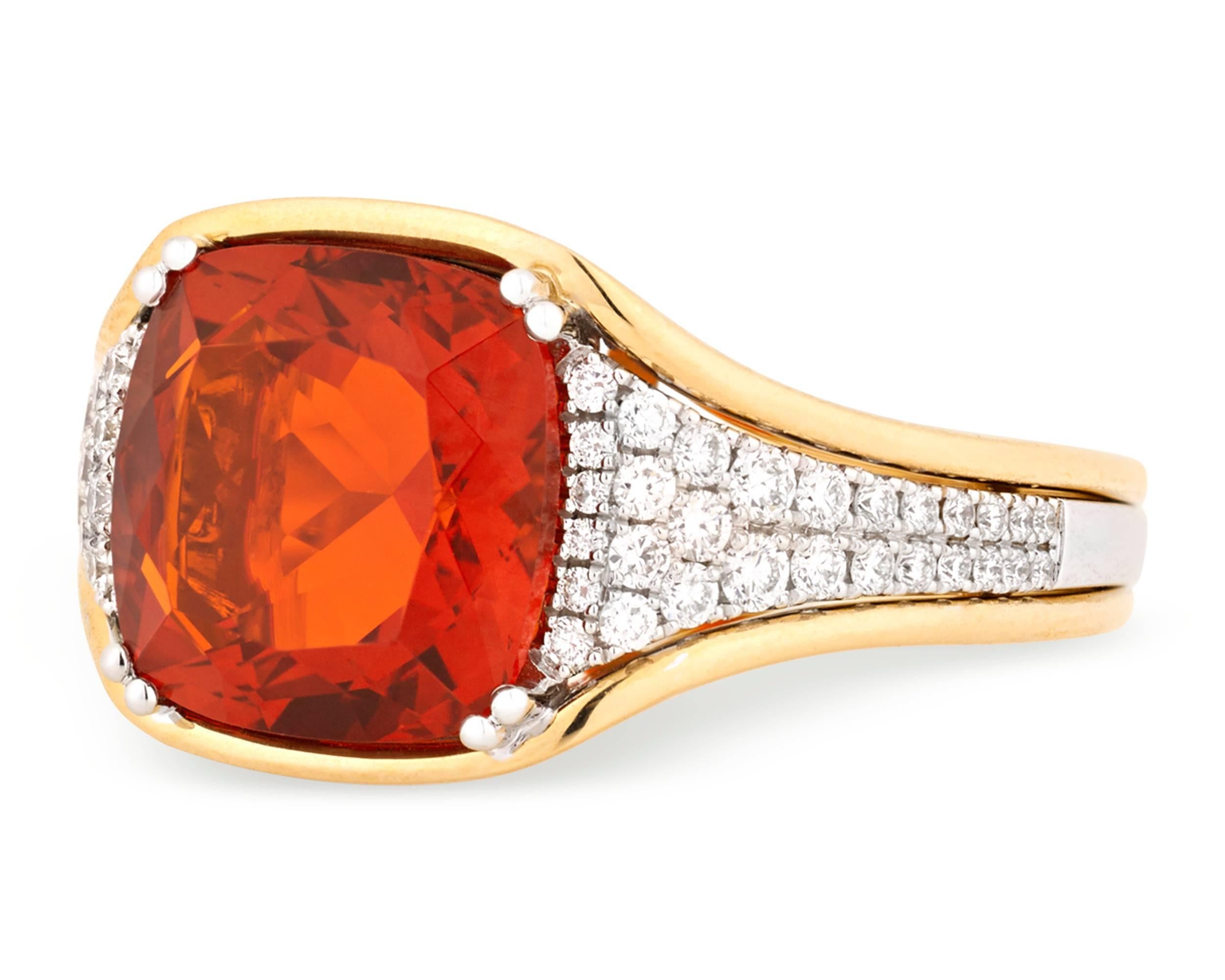 The heat of a magnificent fire opal is perfectly balanced by icy white diamonds totaling 0.40 carat in this eye-catching ring. Weighing 3.40 carats, the rare gemstone displays the signature tangerine orange hue for which this unique stone is known.