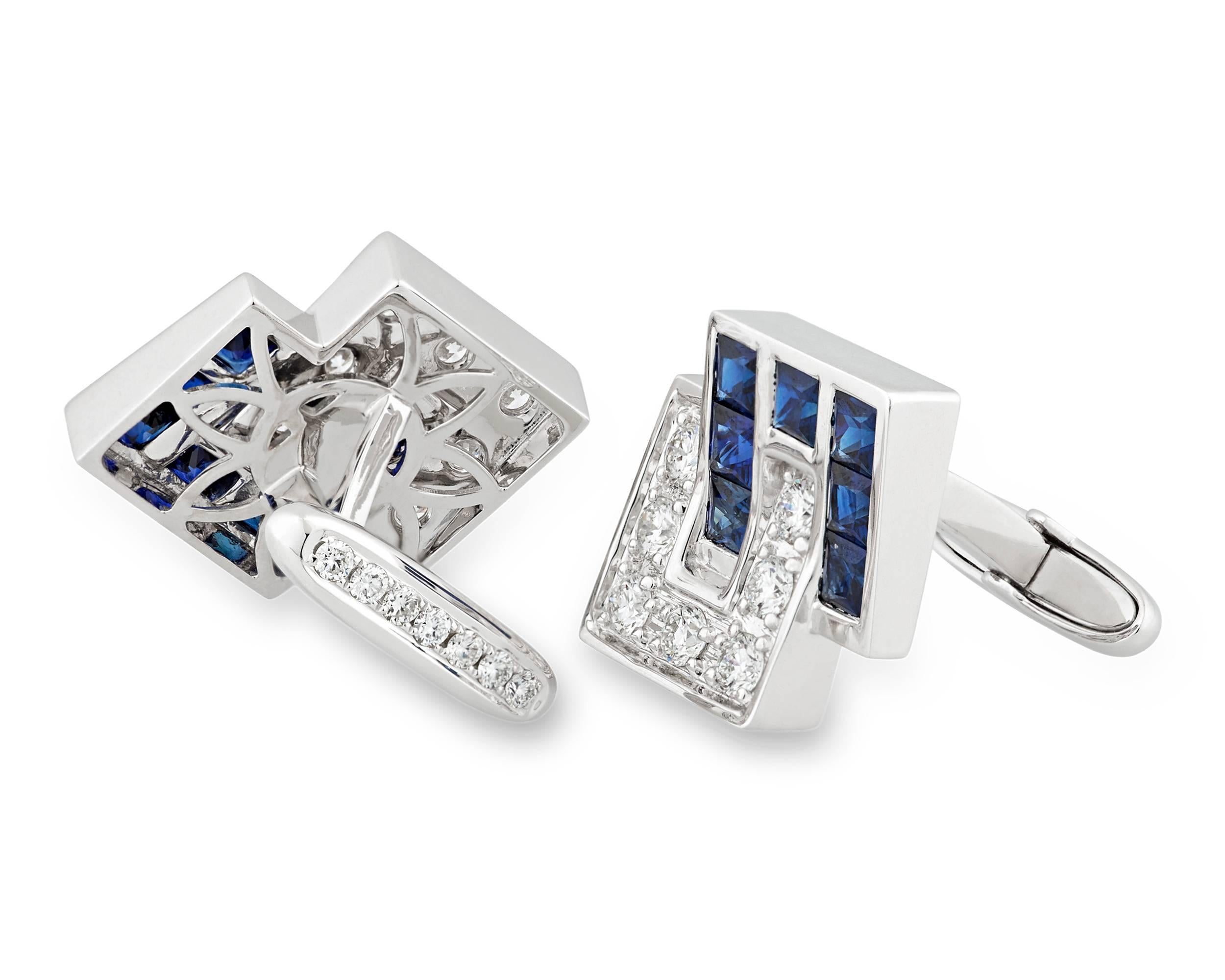 Boasting a bold, linear design, these handsome cufflinks are embedded with 14 sapphires totaling 5.36 carats and 28 round white diamonds totaling 2.49 carats, all channel-set in 18k white gold. A bar connector holds the cufflinks firmly in place,