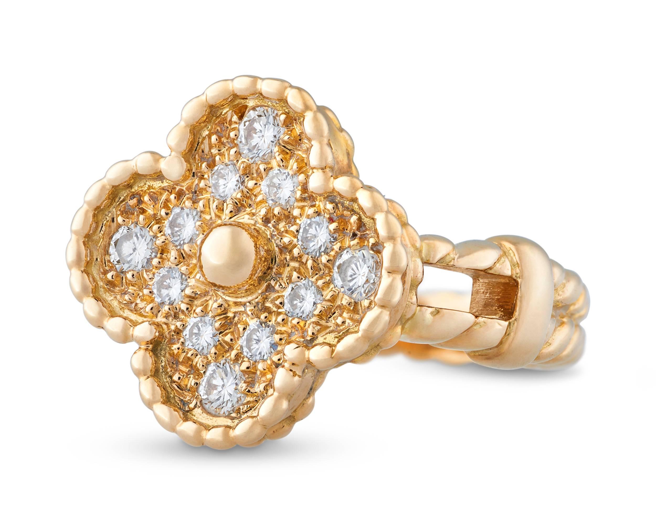 This exquisite diamond ring hails from Van Cleef & Arpels' popular Alhambra Collection. The iconic clover design has been an enduring and highly coveted motif since it was first introduced by the firm in 1968.  Crafted of 18k yellow gold, this ring