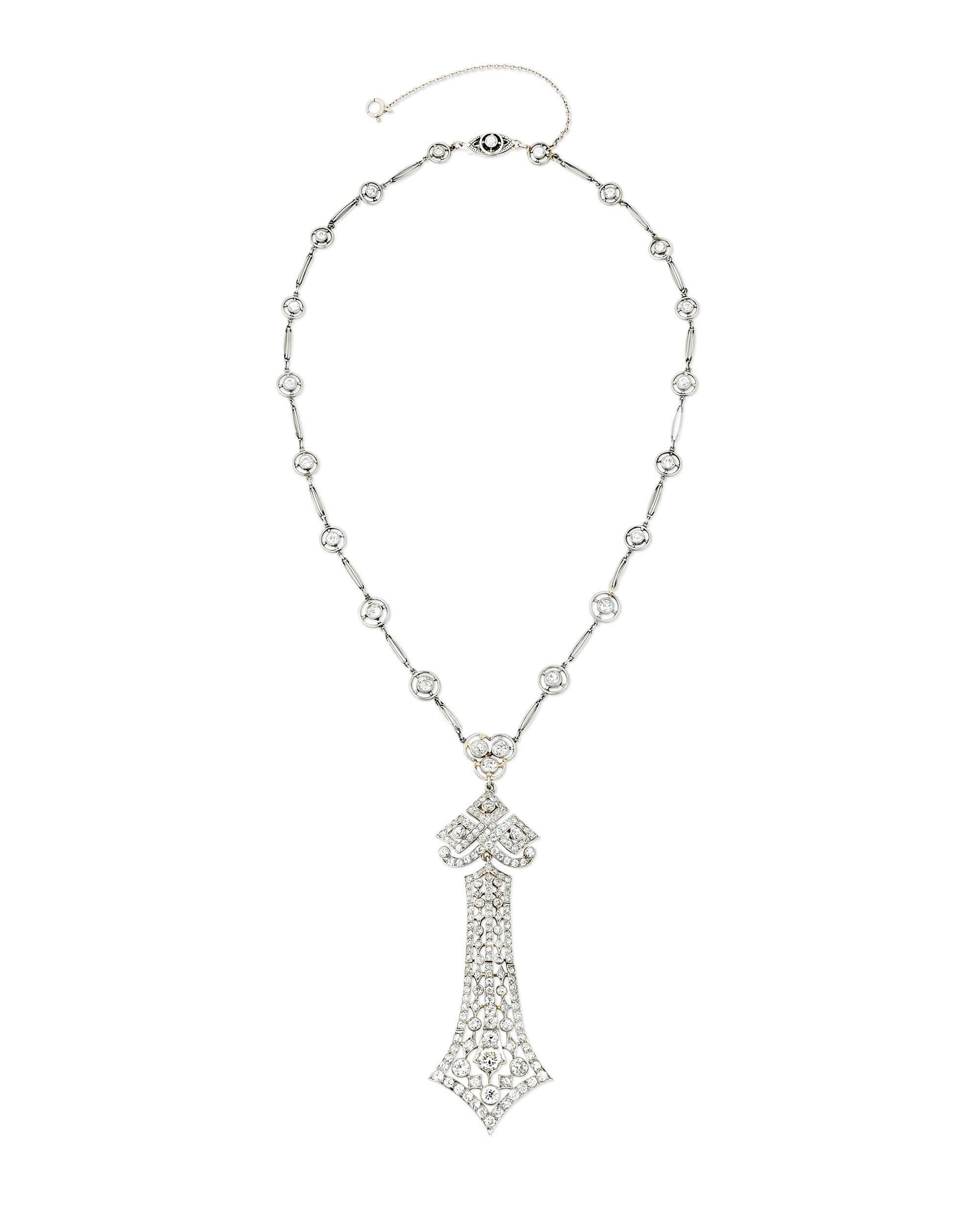 An exquisite design sets apart this Edwardian pendant necklace by the legendary Tiffany & Co. Approximately 4.00 total carats of diamonds adorn the necklace, which boasts a lace-like delicacy thanks to its intricately crafted platinum-over-gold