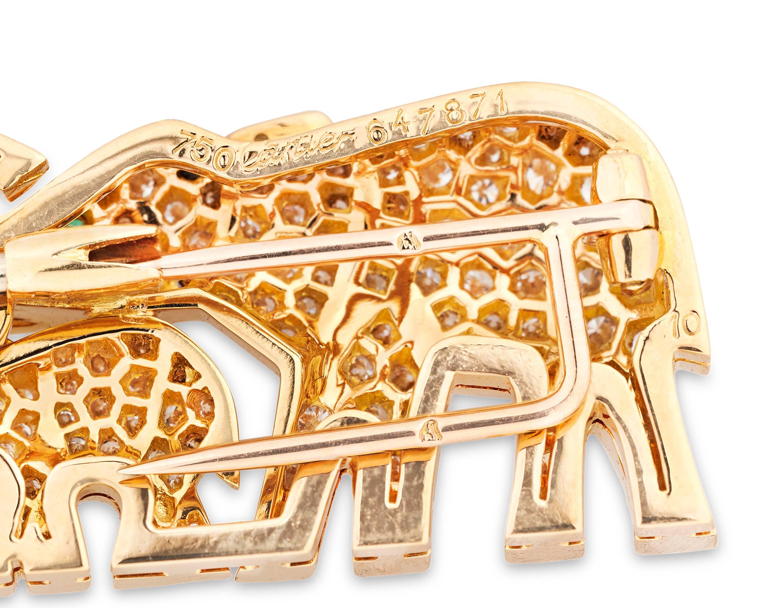 Charming yet elegant, this diamond elephant brooch exemplifies the creative, high-fashion jewelry designs for which the legendary house of Cartier is renowned. Crafted of 18K yellow gold, the pair is embedded with approximately 1.75 total carats of