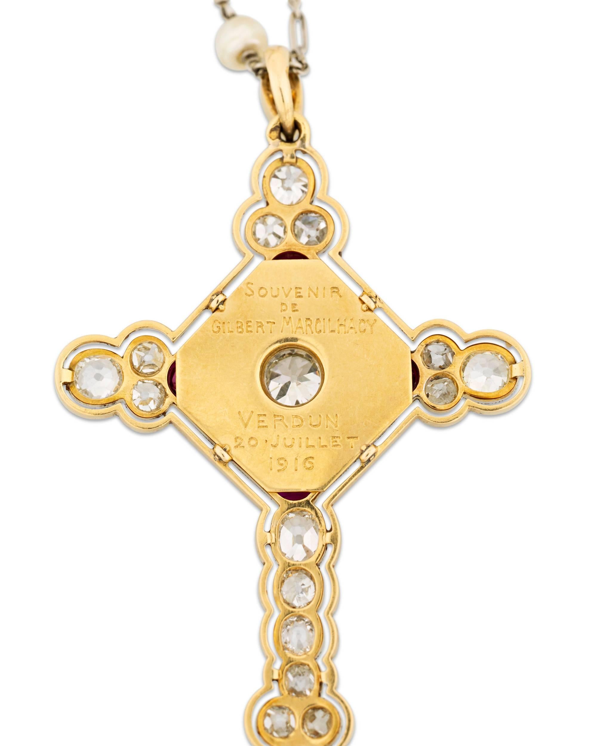 This ornate French cross pendant joins pearls, rubies, and diamonds to absolute perfection. Four teardrop rubies totaling approximately 2.00 carats are paired with four pearls at the pendant's center, while approximately 4.00 total carats of