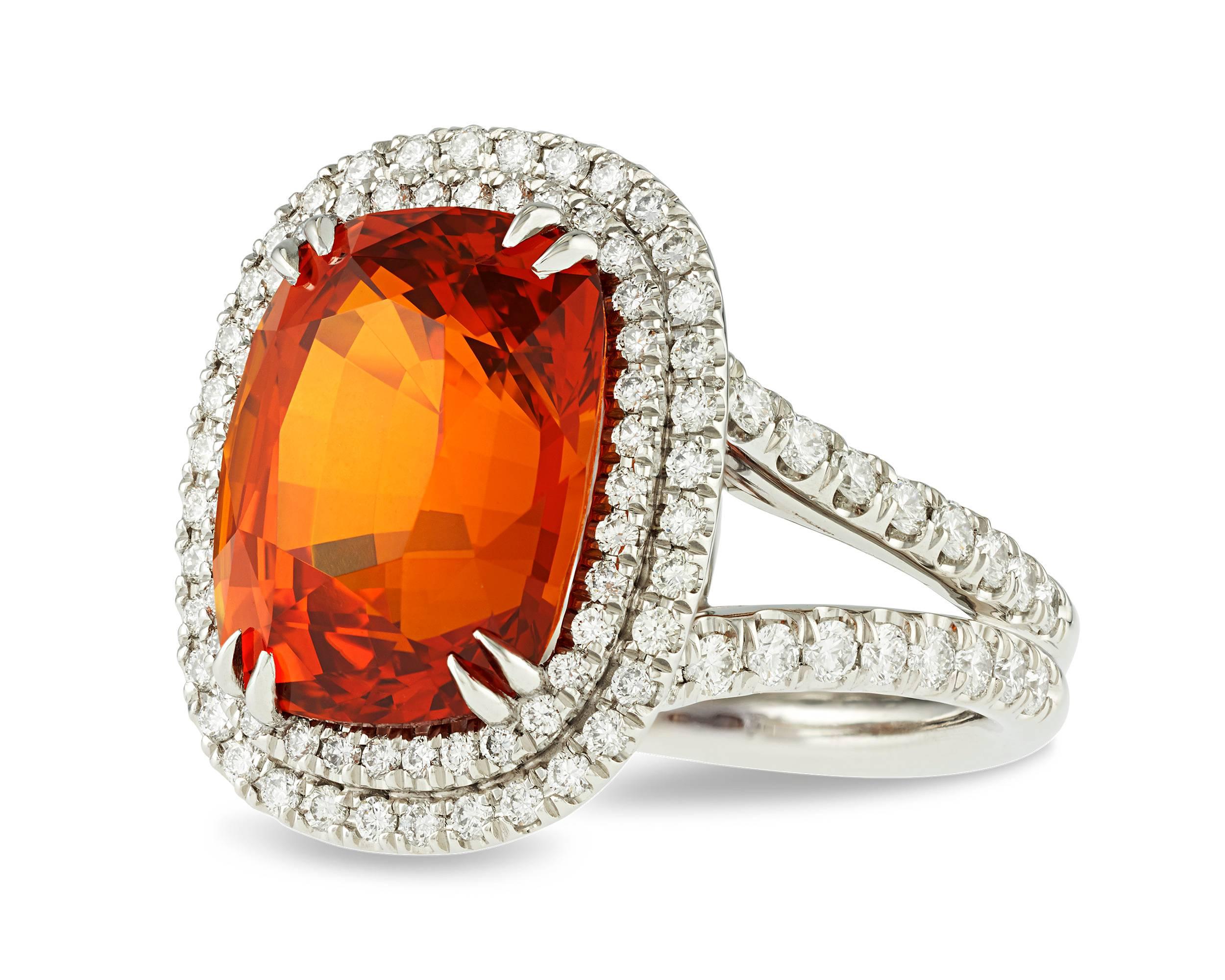 The eye-catching 10.11-carat orange sapphire in this ring possesses an intense color seldom seen in these jewels. While sapphires are most commonly found in shades of yellow or blue, this jewel's rich orange is reminiscent of a mandarin garnet or