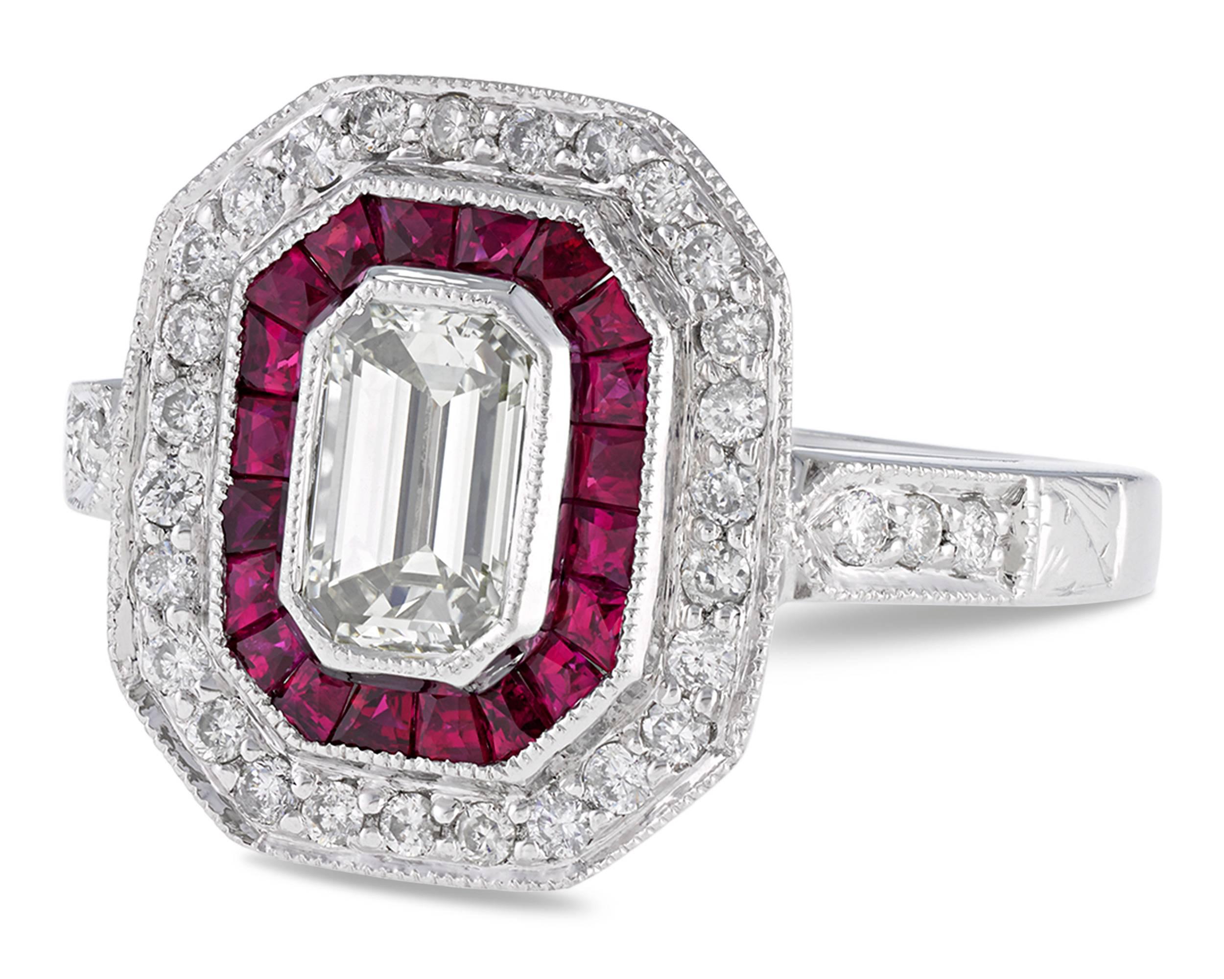 Geometric design and bold, contrasting color define this Art Deco-style diamond and ruby ring. A brilliant 1.21-carat emerald-cut diamond glistens in its center, surrounded by 0.60 total carat of dramatic crimson rubies and 0.35 total carat of