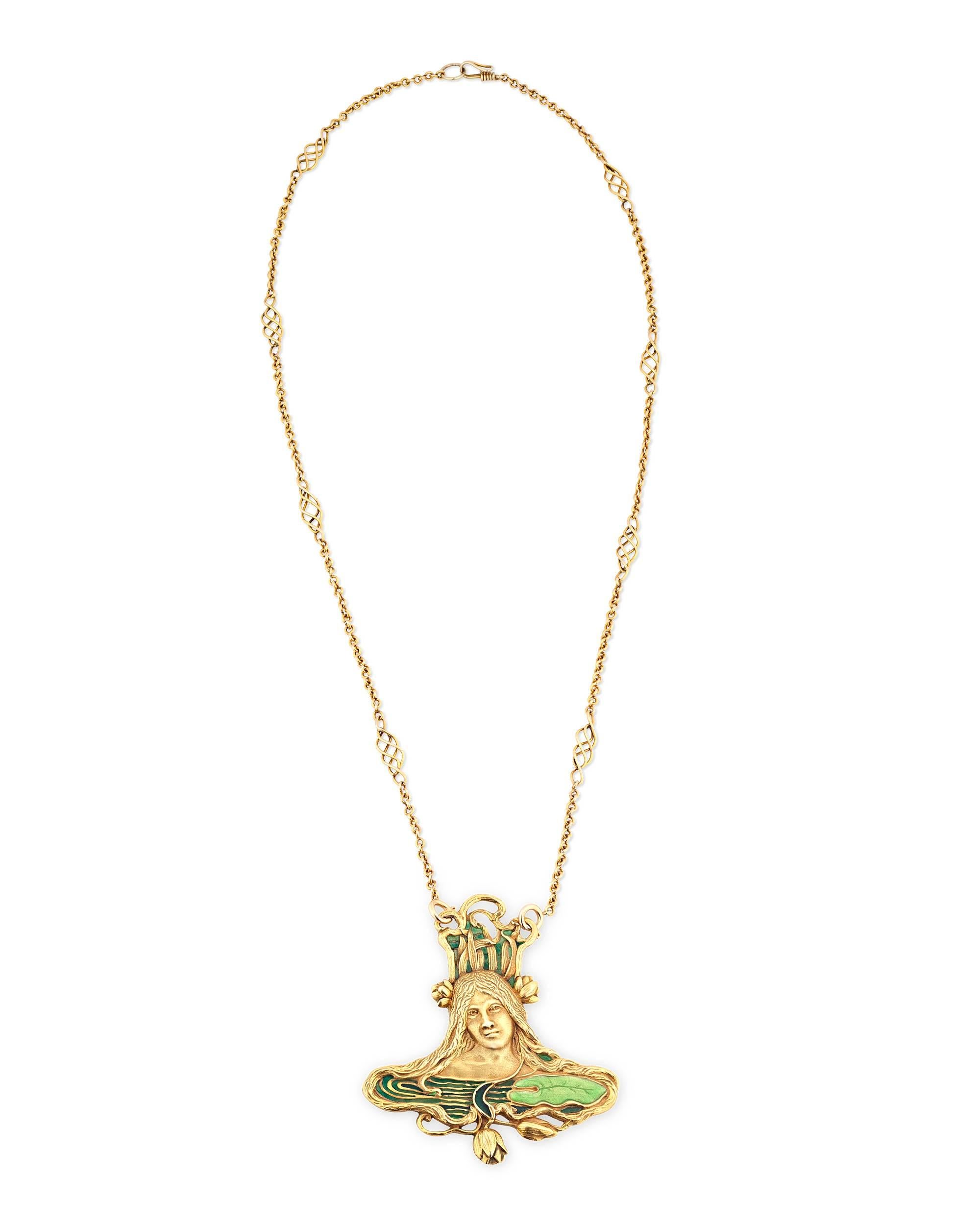A quintessential piece of Art Nouveau design, this pendant, and a matching chain is the work of Art Nouveau designer Louis Zarra. Sculpted from 18k yellow gold, the pendant takes the form of a beautiful woman with flowing tresses surrounded by