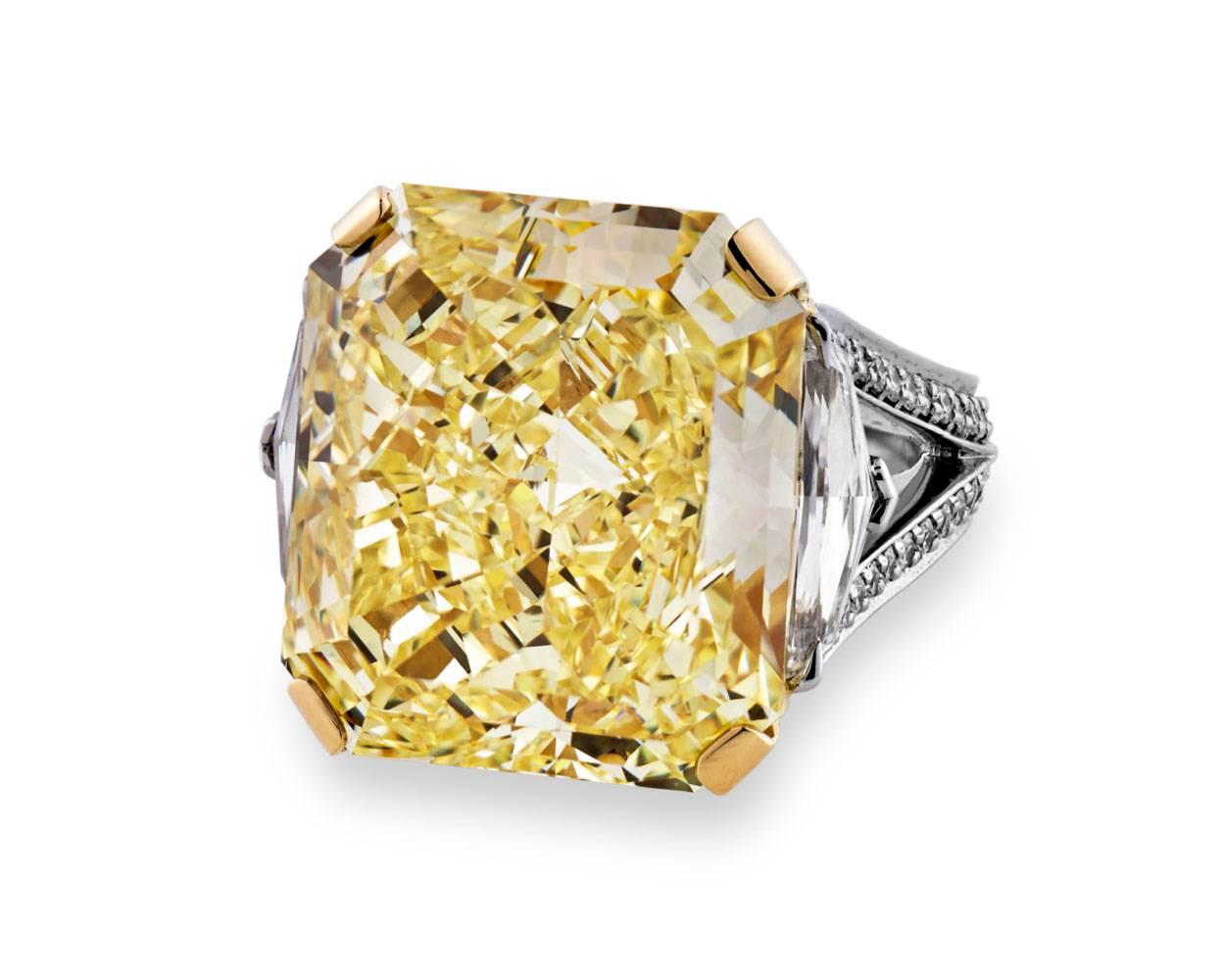 Displaying exceptional brilliance, this remarkably rare gemstone is one of the best fancy intense yellow diamonds on the market today. Weighing 21.30 carats, the diamond exhibits an intensity of color that is enhanced by its exquisite mixed cut.