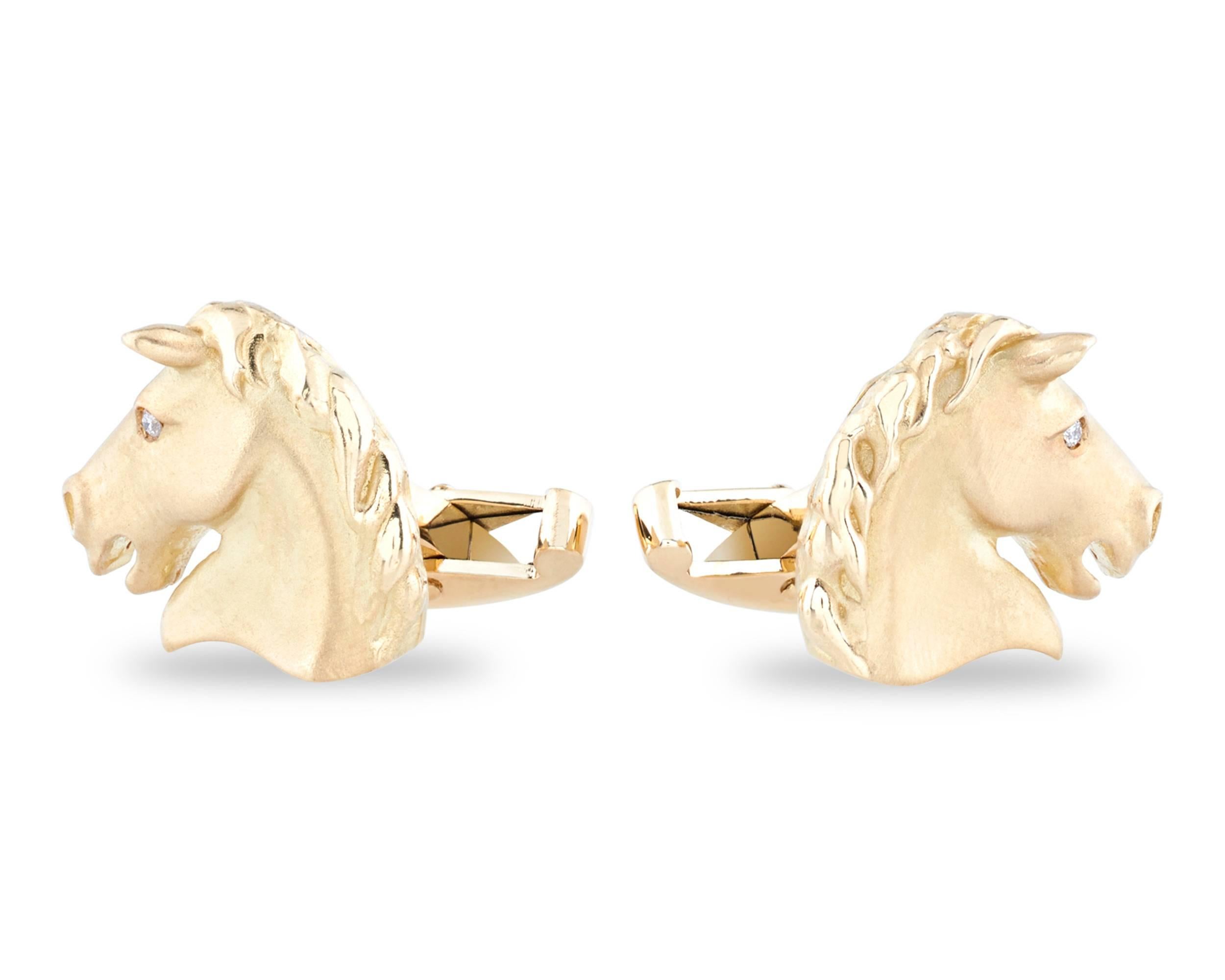 This handsome pair of 18K yellow gold horse cufflinks is simply adorned with two white diamonds accents at the eye.

Hallmarked 750 with anchor assay mark of Birmingham, England

5/8