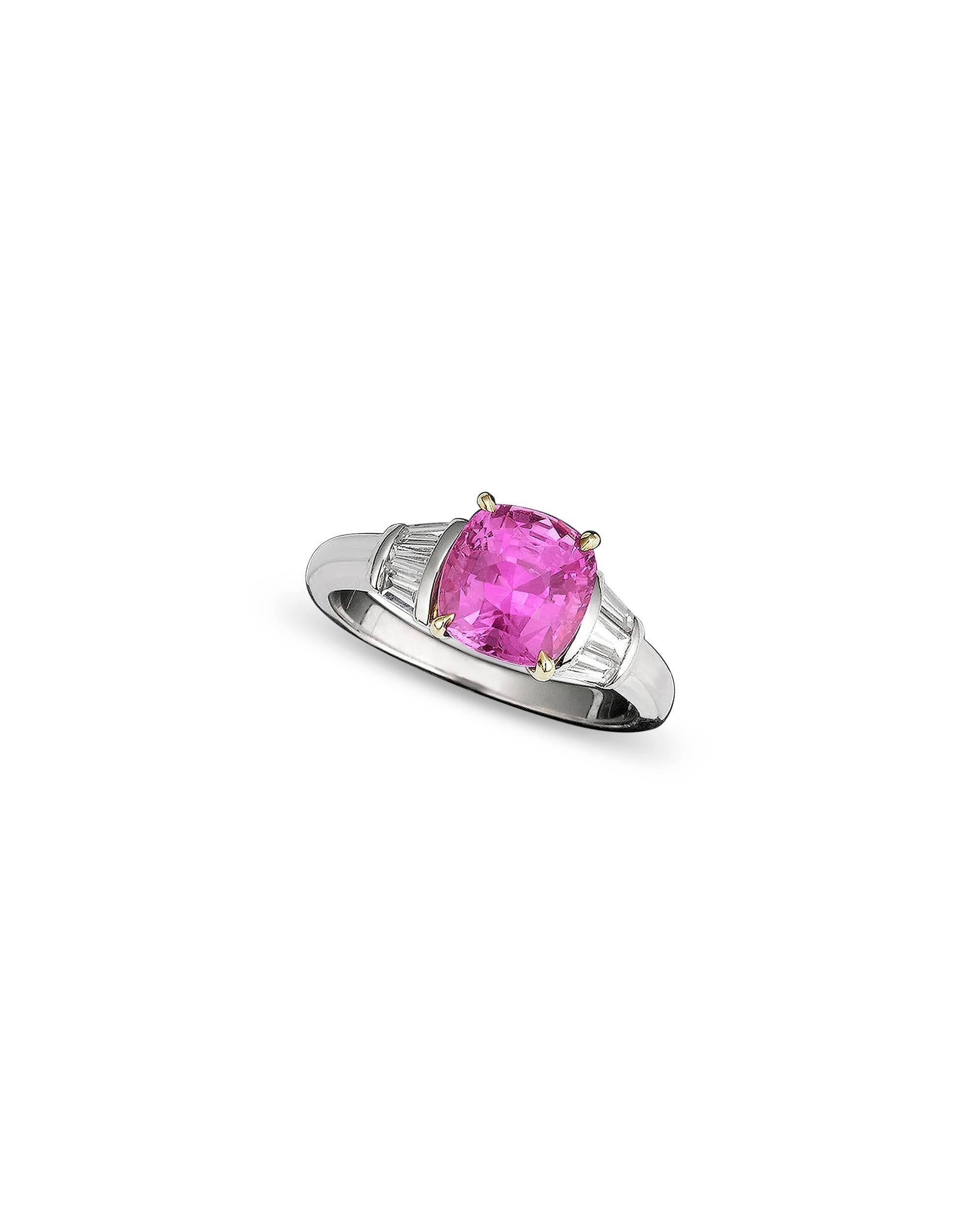 Exceptional color and transparency distinguish the incredibly rare pink sapphire in this enchanting ring. Certified by the American Gem Trade Association (AGTA) as being completely natural with no heat treatment, this 2.79-carat jewel is flanked by