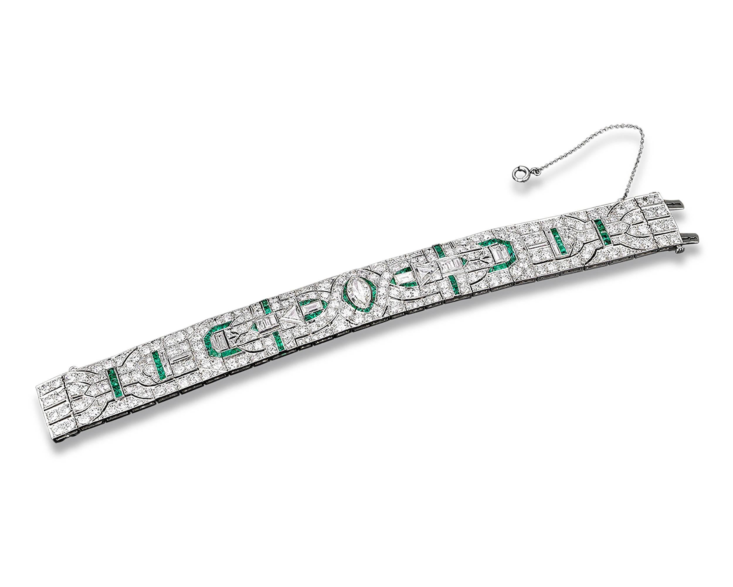 This lovely Art Deco bracelet is set with approximately 21.75 carats of brilliant diamonds. The striking geometric design also incorporates approximately .75 carats of emeralds, whose verdant beautifully complements the diamonds’ sparkle. Crafted of