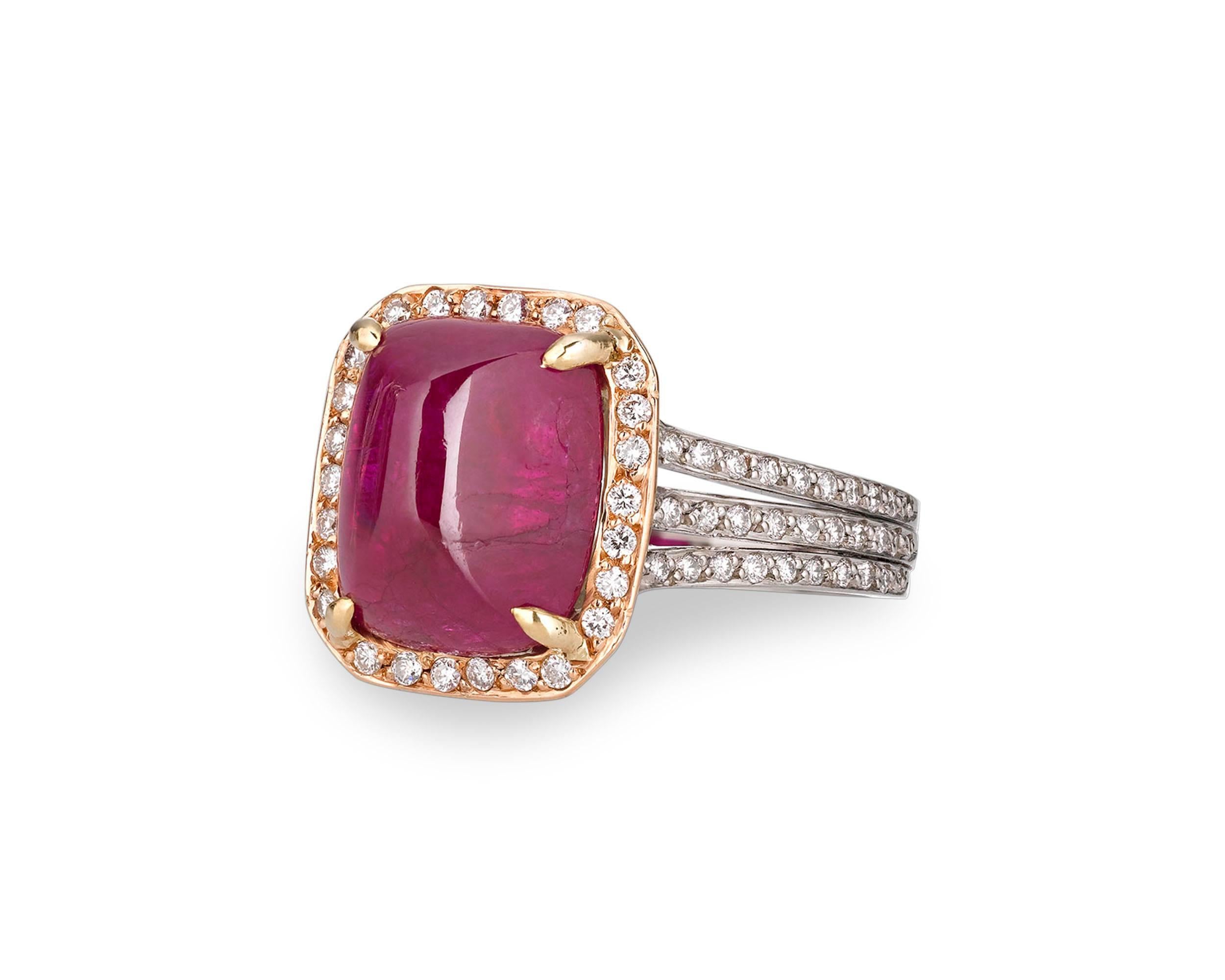 A rare Burma cabochon ruby positively captivates amid a halo of diamonds in this extraordinary ring. The exceptional jewel weighs 6.31 carats and its sugarloaf cut perfectly showcases the intense red hue for which Burma rubies are so coveted.