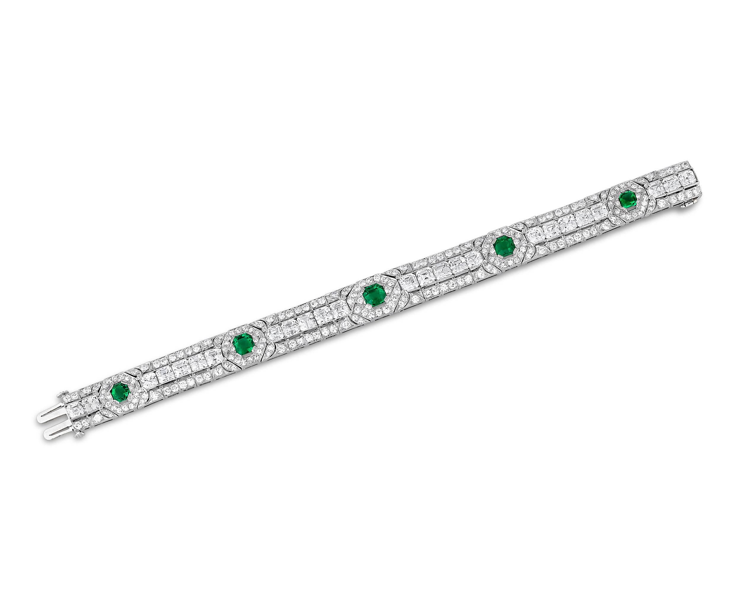 Five breathtaking, classic Colombian emeralds are showcased in this amazing Art Deco-era jeweled masterpiece. Totaling 3.77 carats, these emeralds are certified by the American Gemological Laboratories as untreated and Colombian in origin, meaning