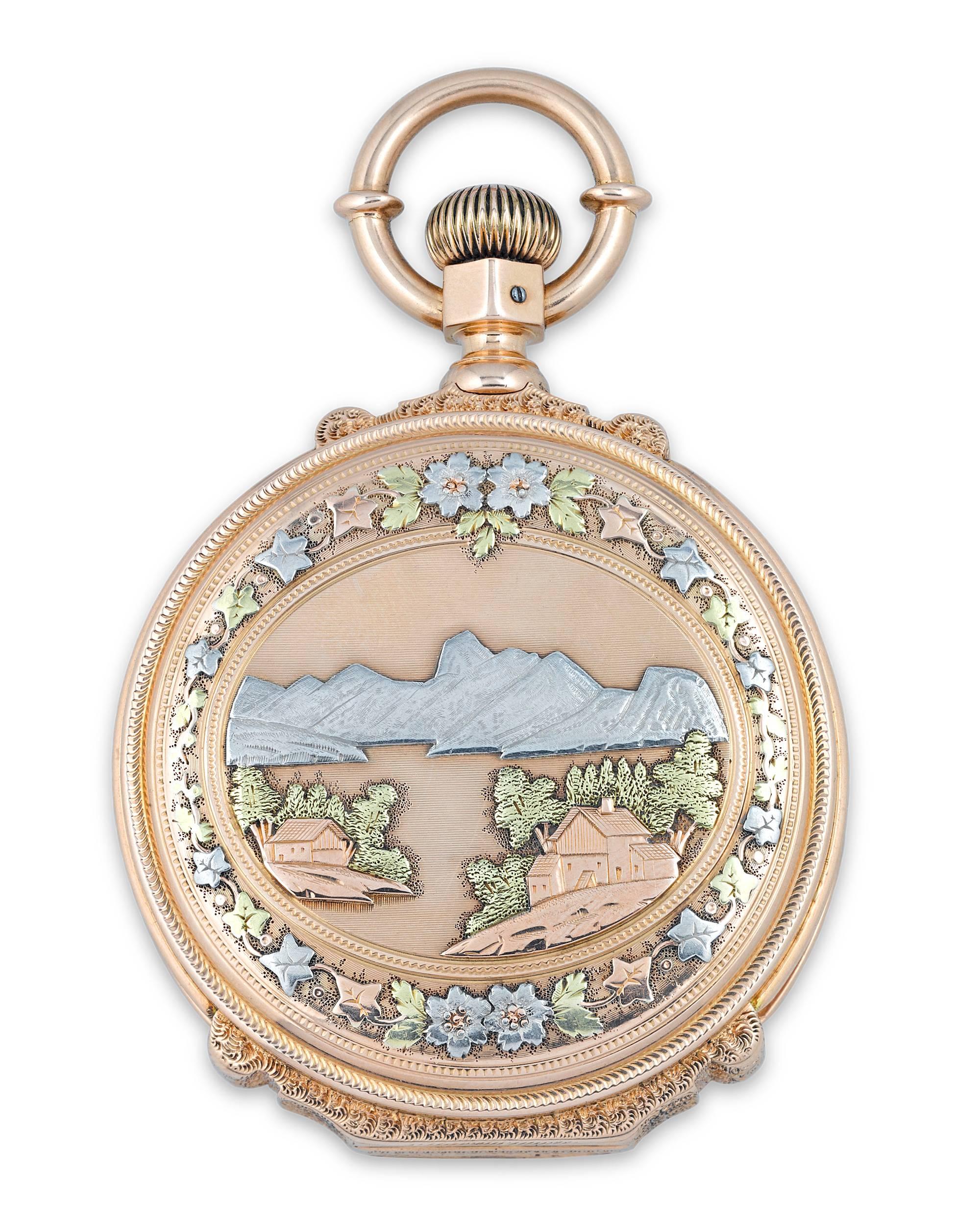 Housed in a majestic case of 14K yellow, rose, white and green gold, this pocket watch crafted by the American Watch Co. is as exquisite as it is functional. Masterfully engraved and chased, the case features an awe-inspiring mountain landscape with