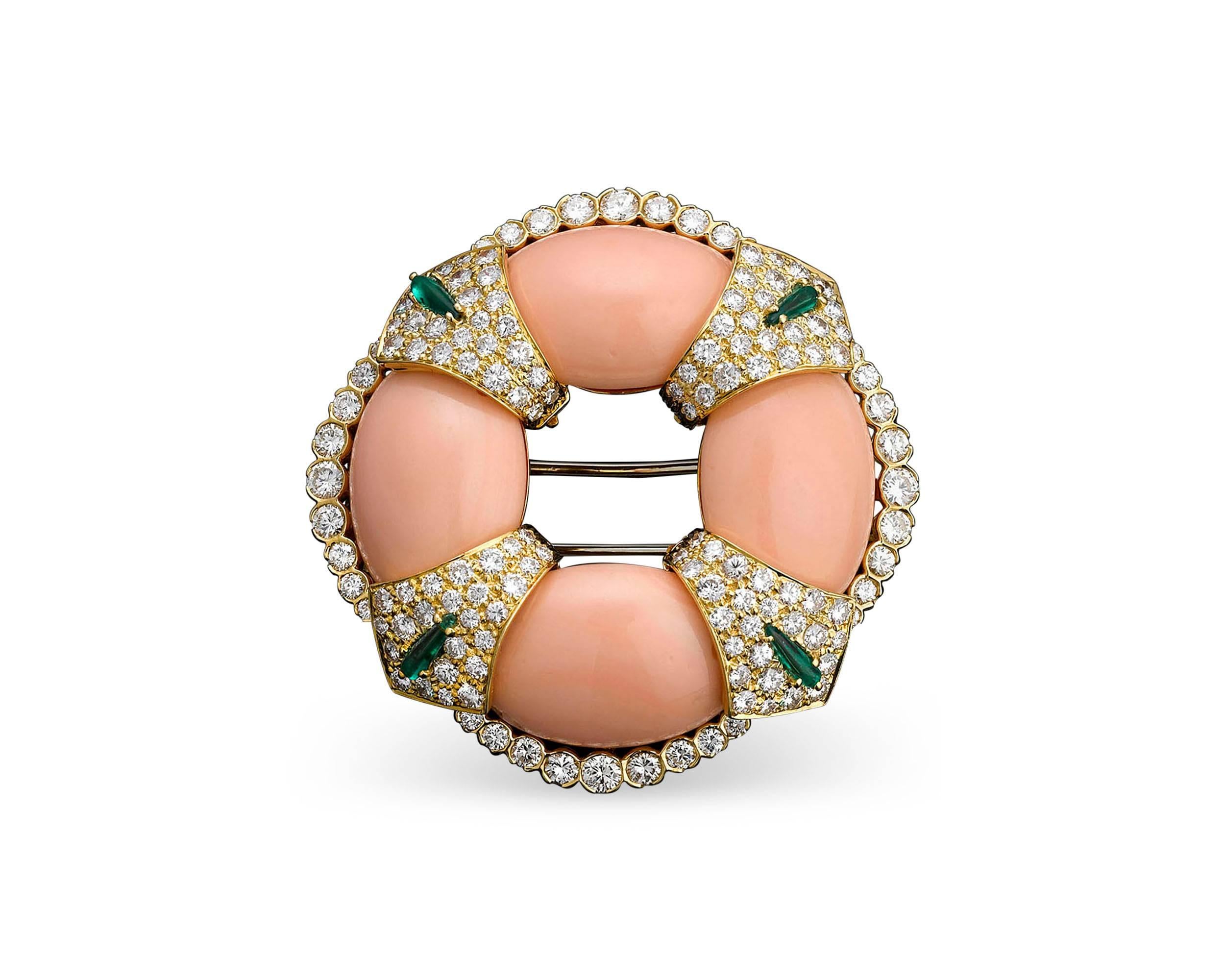 This enchanting coral and diamond brooch by David Webb exudes a classic refinement. Four exquisite coral cabochons takes center stage, each exhibiting the delicate “angel skin” hue. Their subtle beauty is accented by approximately 2.50 carats of