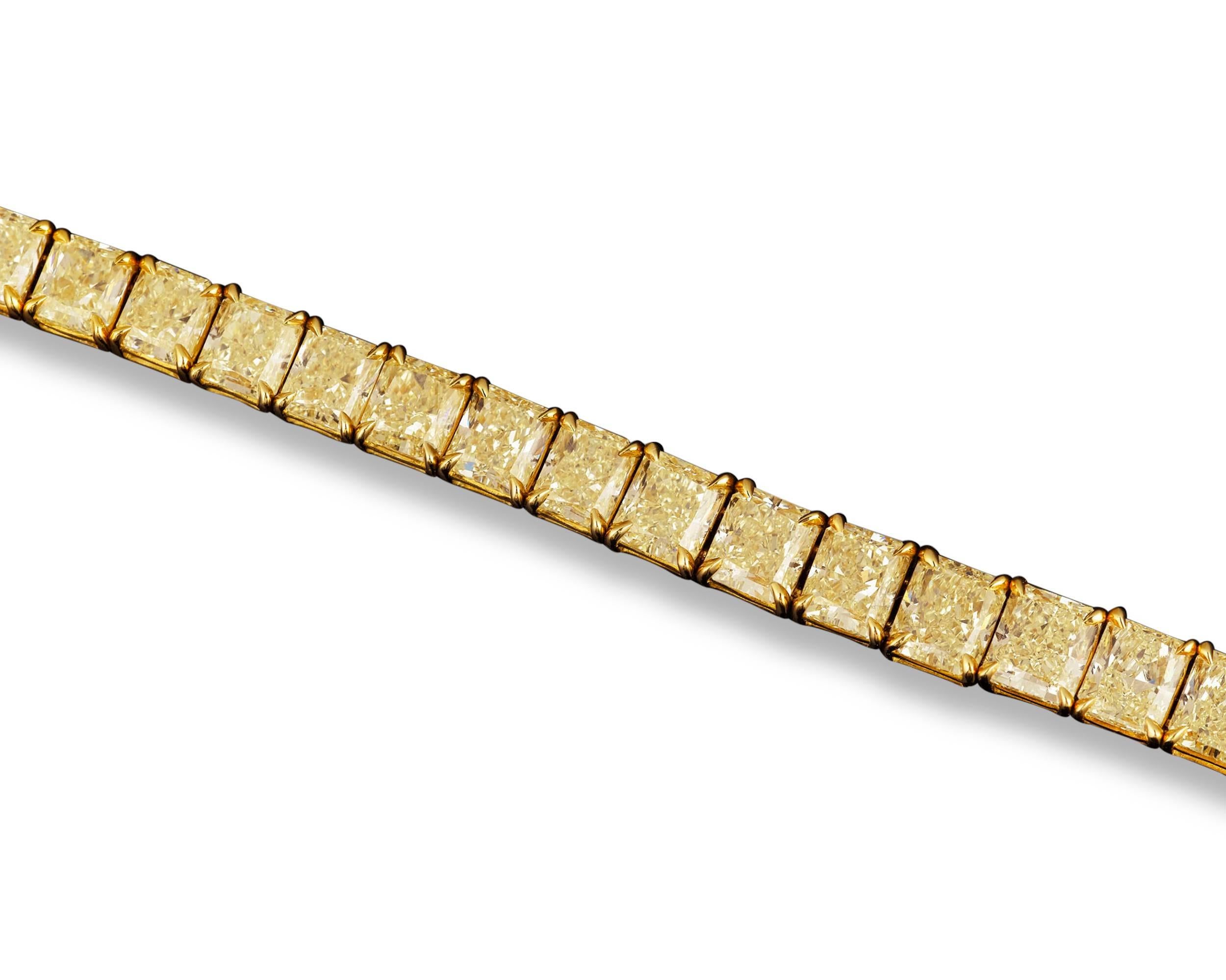 This incredible bracelet boasts 31 rare and perfectly matched natural fancy yellow diamonds totaling 32.08 carats. Set in 18K yellow gold, these beautiful, radiant-cut diamonds, weighing approximately 1.03 carats each, sparkle with intense fire and